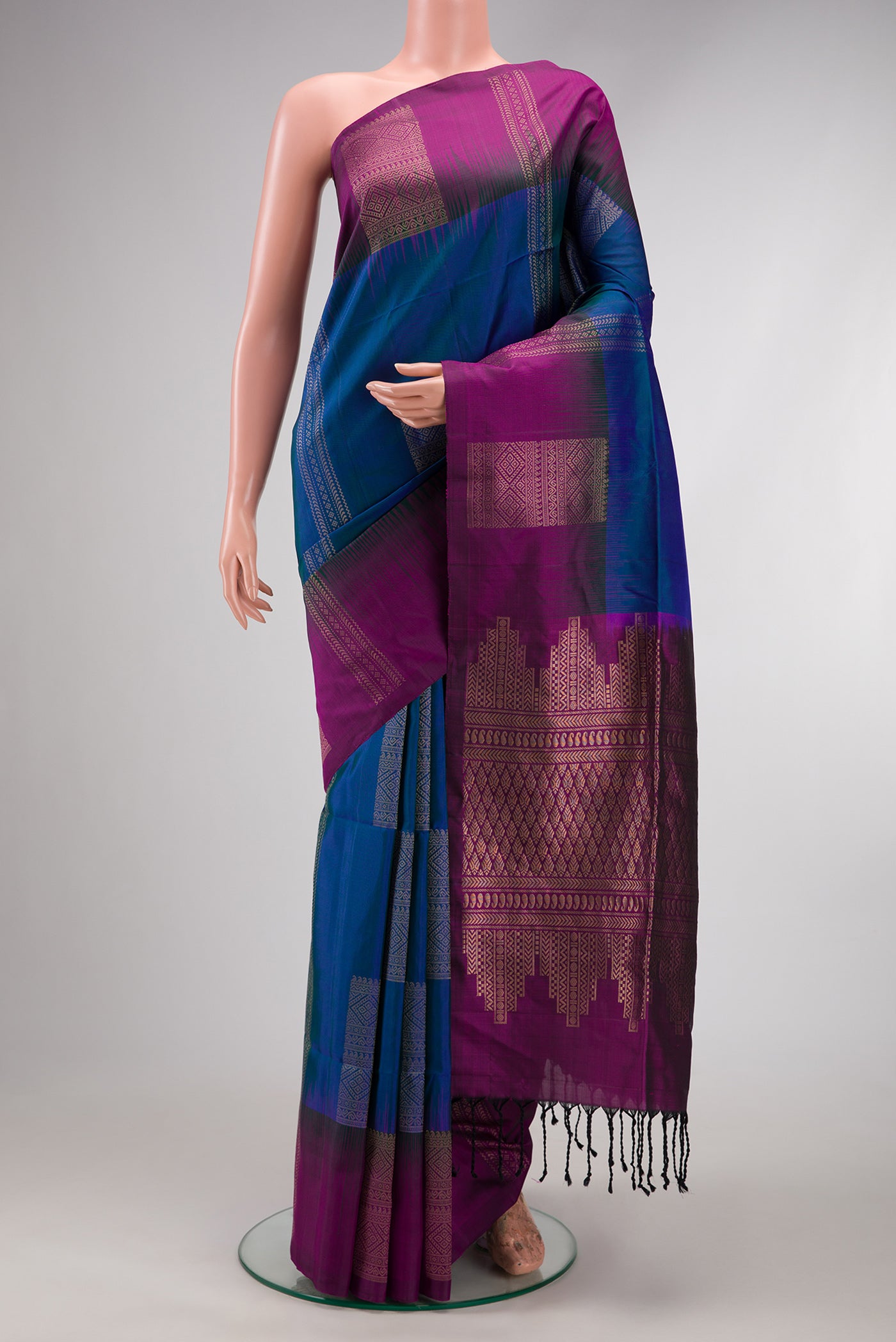 Navy Blue Soft Silk Saree with Zari Butta on the body and Fancy Border.  displayed on a mannequin
