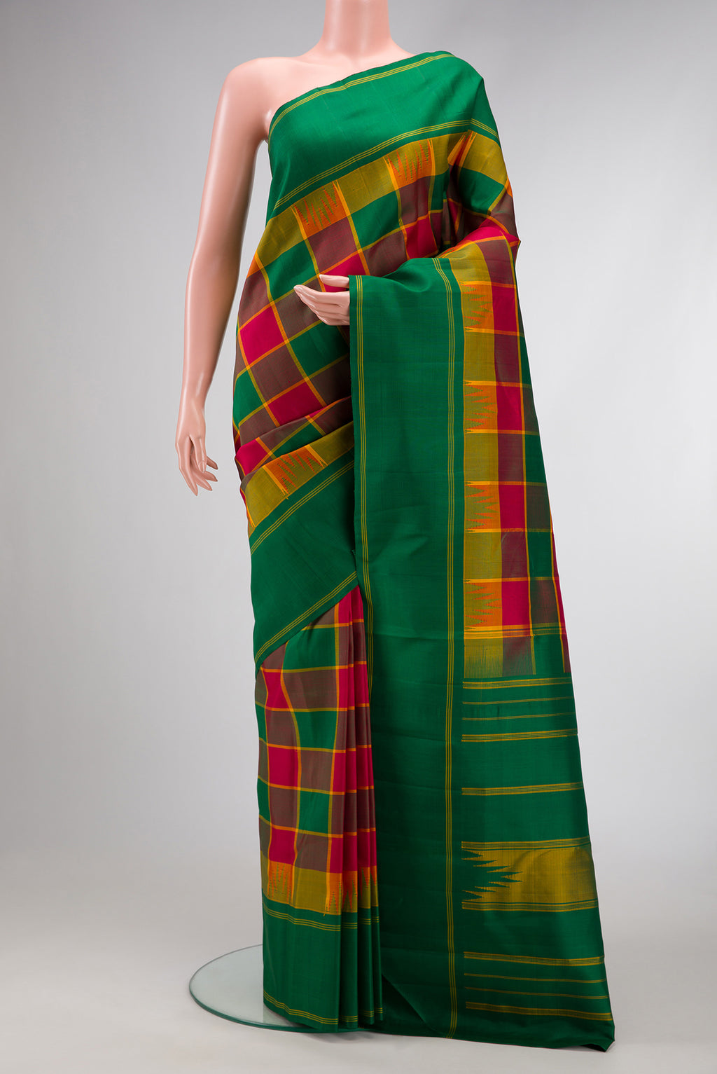 Green, Maroon & Burgundy Color Kanjivaram Silk Saree with Checked design on the body and Plain Border.  displayed on a mannequin