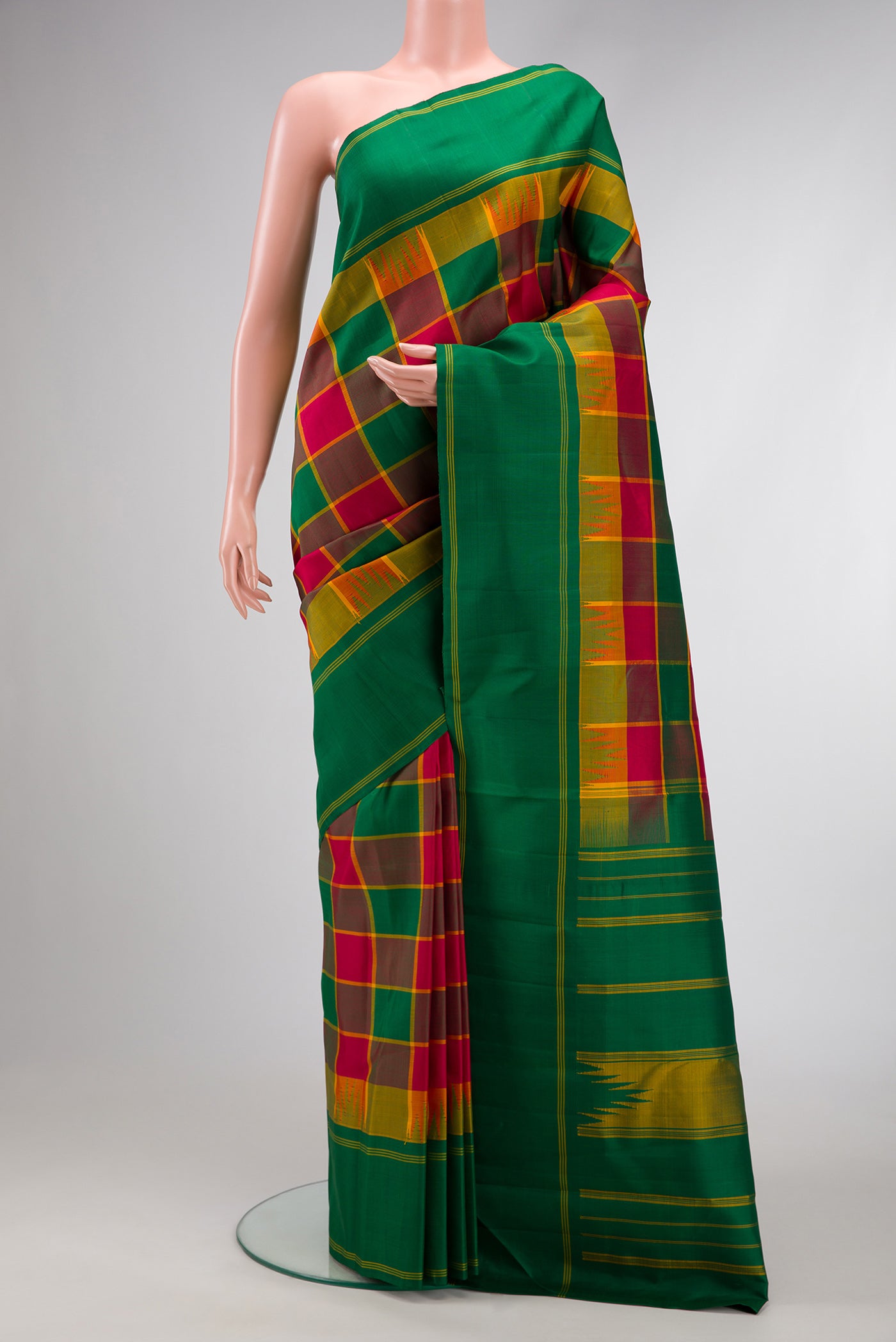 Green, Maroon & Burgundy Color Kanjivaram Silk Saree with Checked design on the body and Plain Border.  displayed on a mannequin