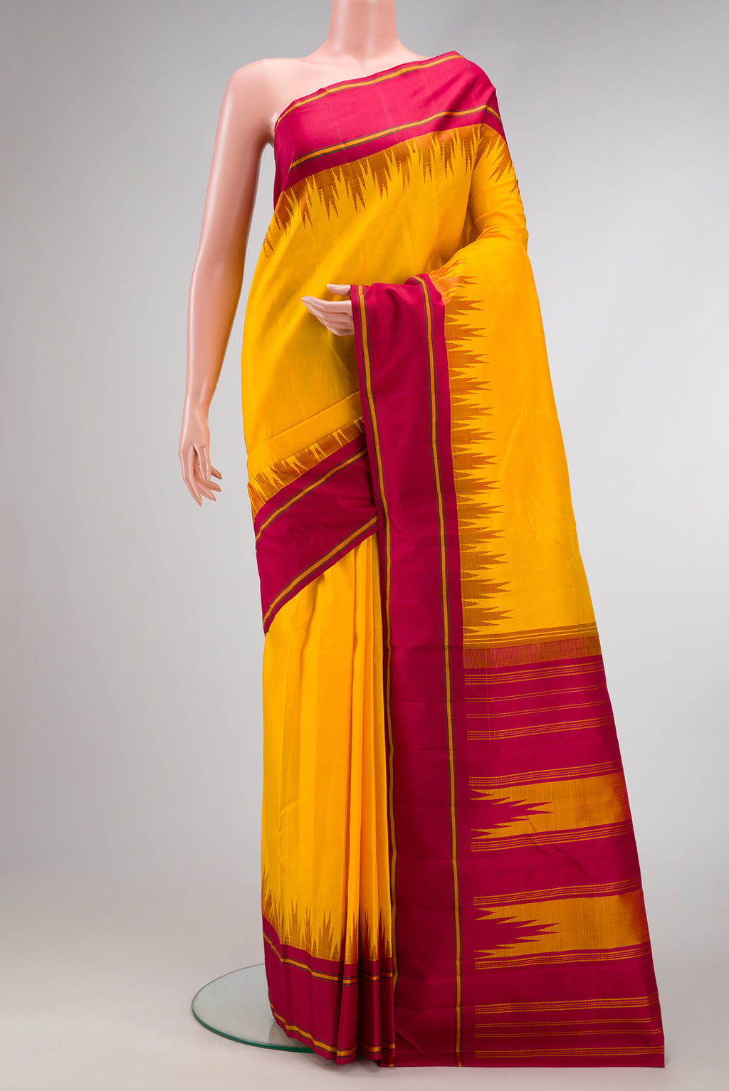 Yellow Dual Tone Kanjivaram Silk Saree with Plain Body and Temple Border.  displayed on a mannequin