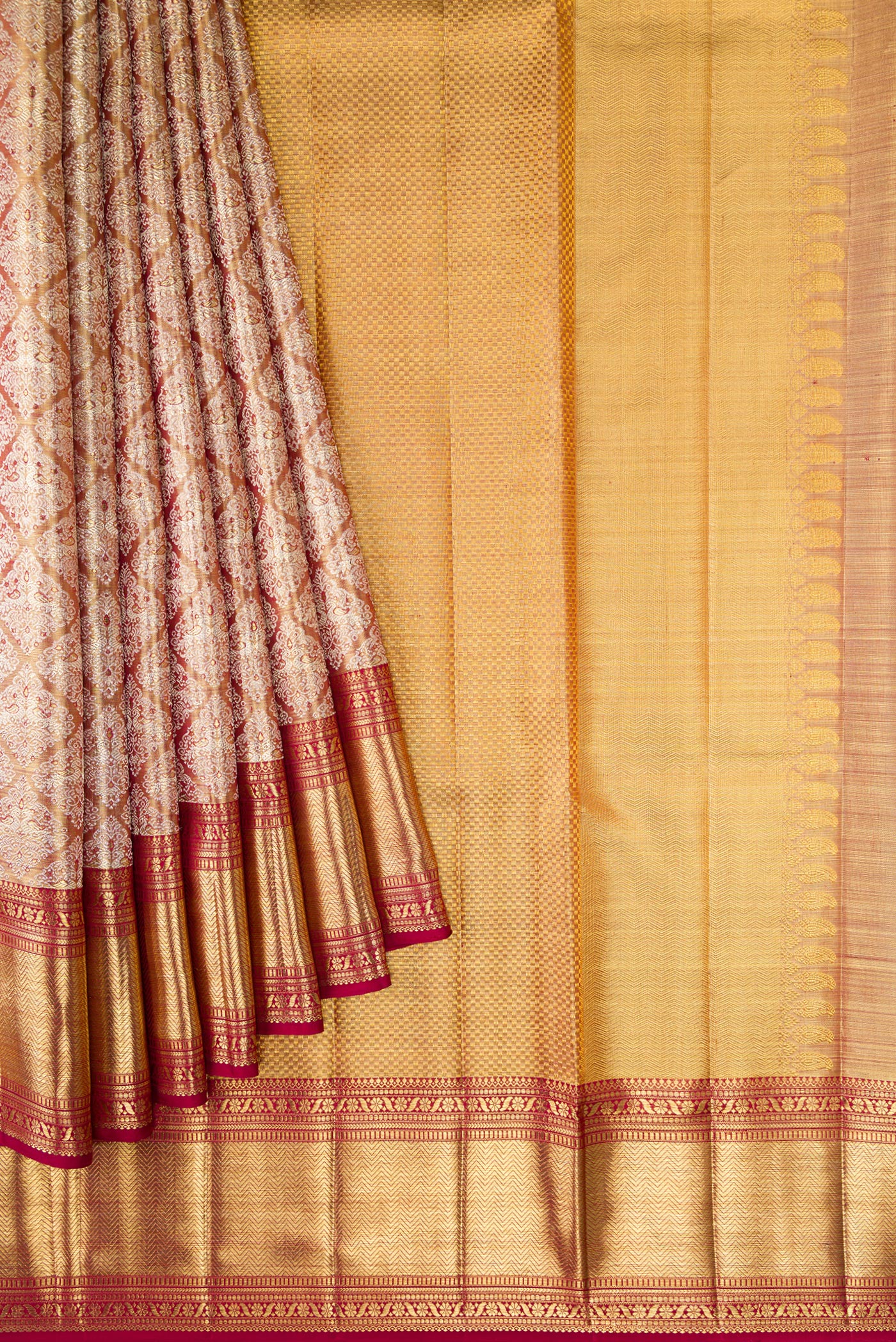Pleats and pallu of Gold Dual Tone Kanjivaram Tissue Silk Saree with Zari Brocade on the body and Zari Border. 