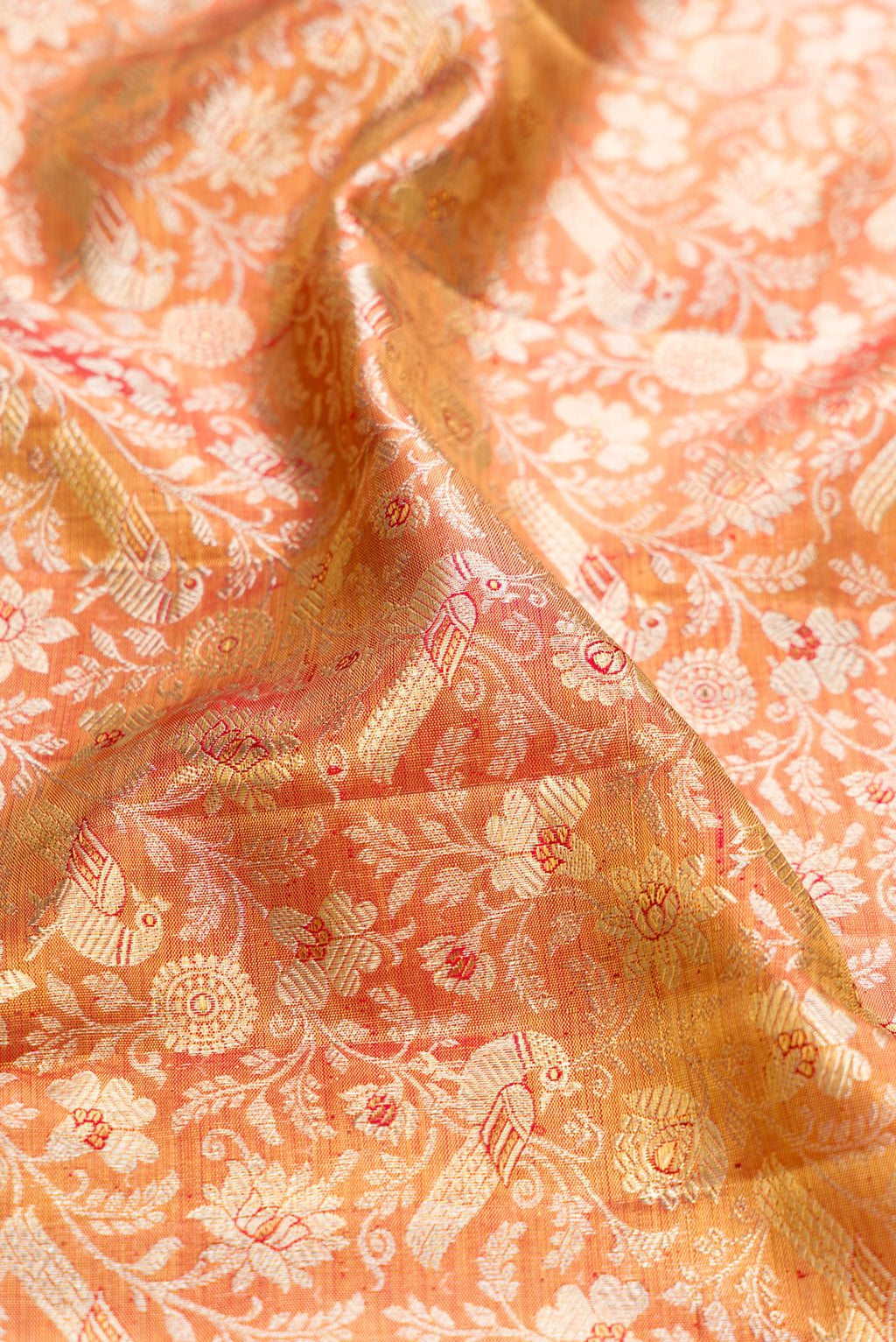 Close up of Gold Dual Tone Kanjivaram Tissue Silk Saree with Zari Brocade on the body and Zari Border.  displaying folds