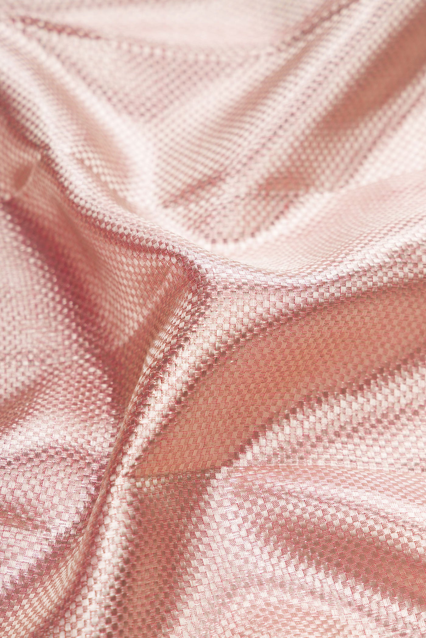 Close up of Pink Dual Tone Kanjivaram Tissue Silk Saree with Zari Brocade on the body and Zari Border.  displaying folds