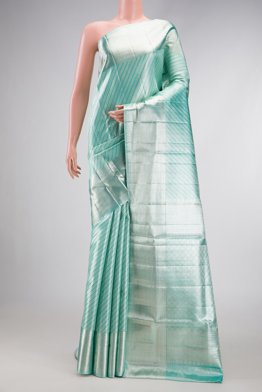 Pure Silk Pure Zari Sky Blue Dual Tone Kanjivaram Tissue Saree with Zari Brocade on the body and Zari Border.  displayed on a mannequin