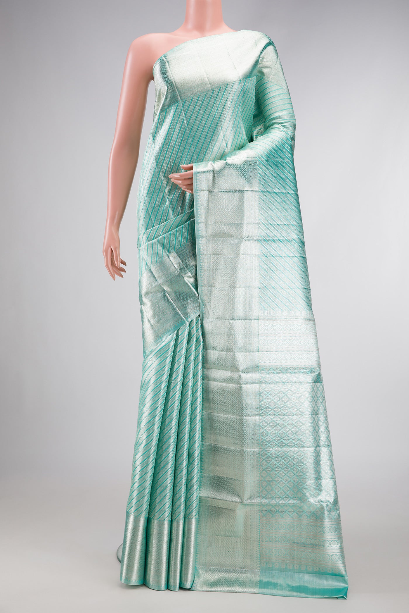 Pure Silk Pure Zari Sky Blue Dual Tone Kanjivaram Tissue Saree with Zari Brocade on the body and Zari Border.  displayed on a mannequin