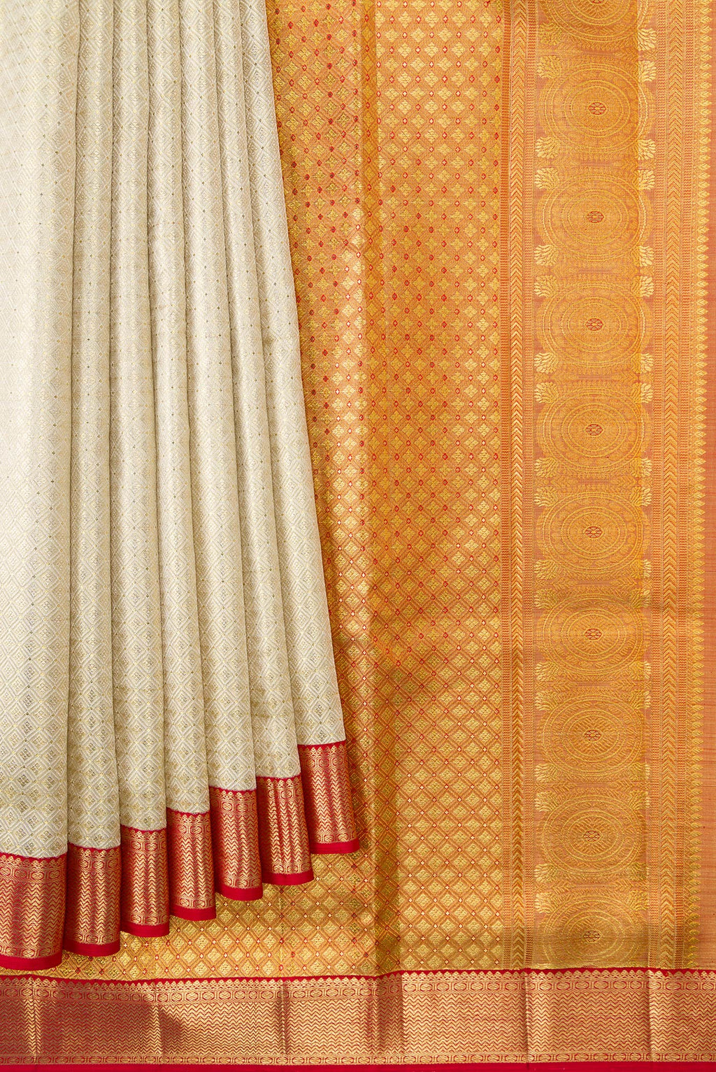 Pleats and pallu of Off White Dual Tone Kanjivaram Tissue Silk Saree with Zari Brocade on the body and Zari Border. 