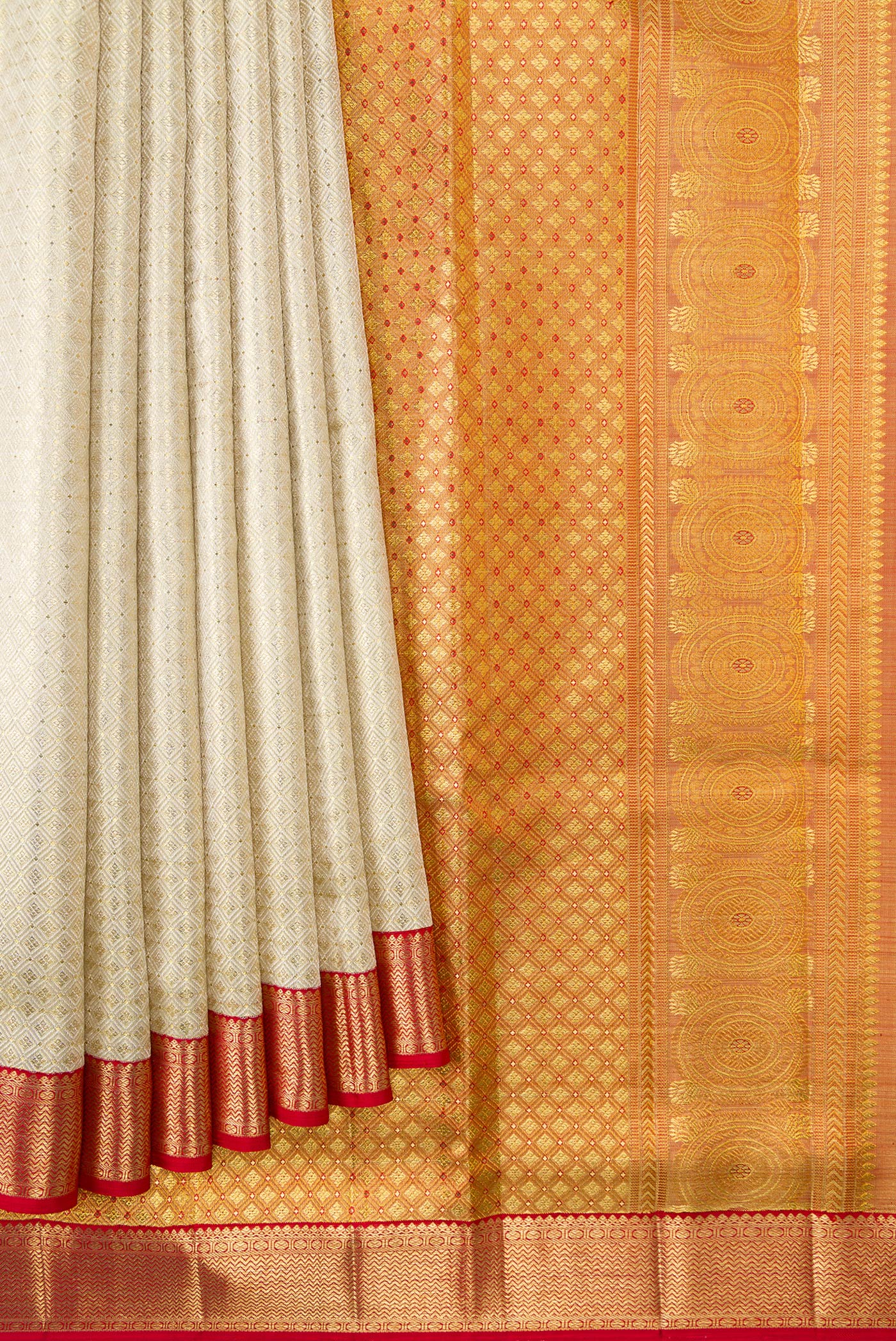 Pleats and pallu of Off White Dual Tone Kanjivaram Tissue Silk Saree with Zari Brocade on the body and Zari Border. 