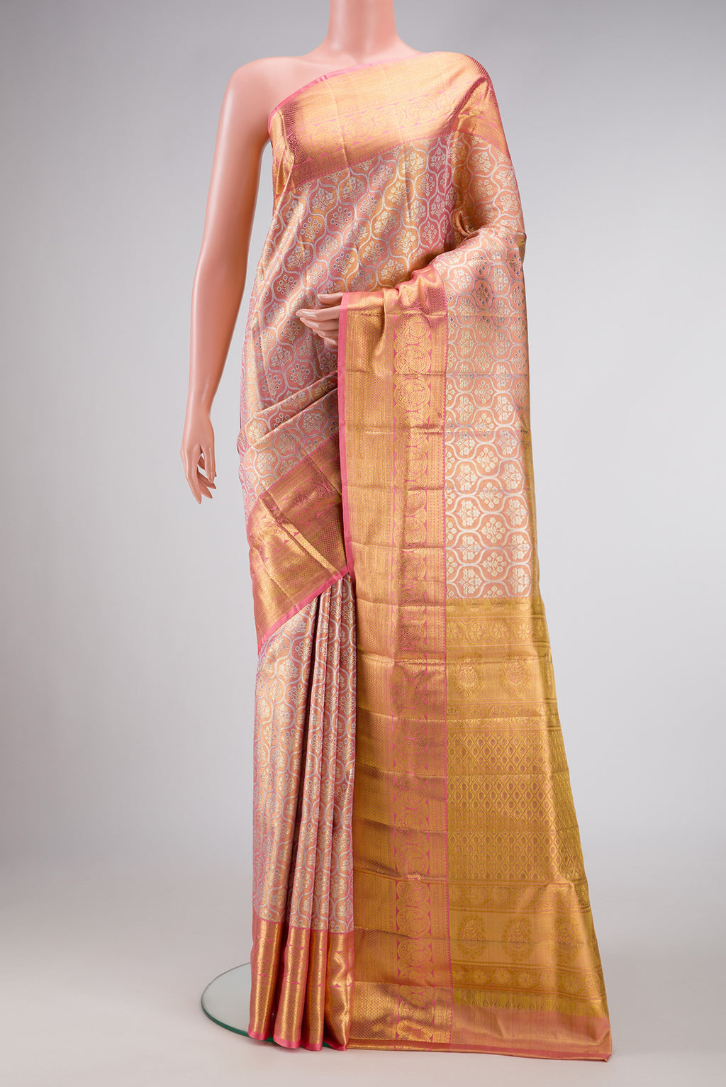 Pink Dual Tone Kanjivaram Tissue Silk Saree with Zari Brocade on the body and Zari Border.  displayed on a mannequin