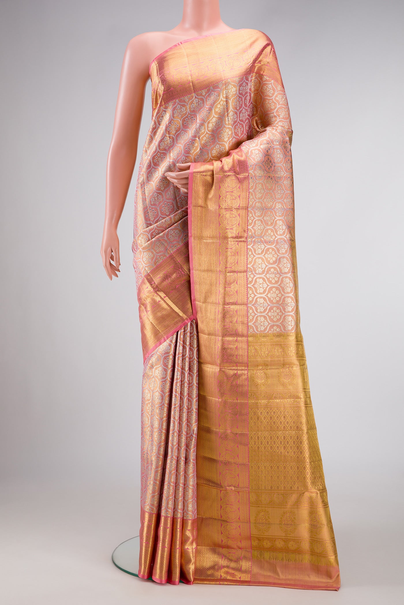 Pink Dual Tone Kanjivaram Tissue Silk Saree with Zari Brocade on the body and Zari Border.  displayed on a mannequin