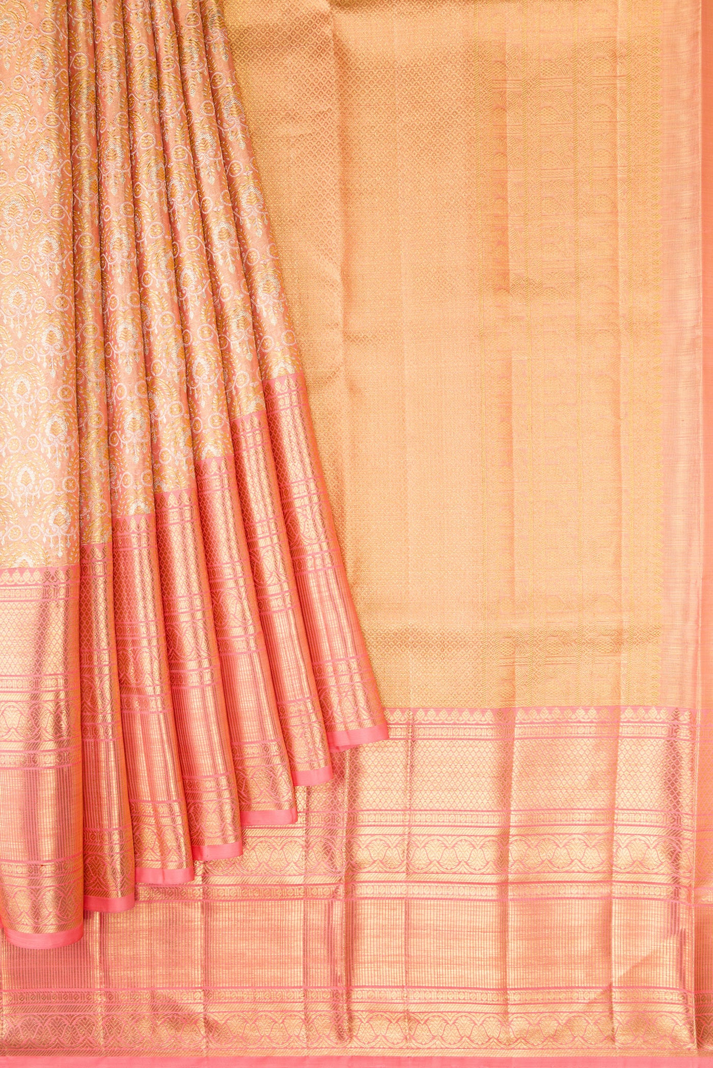 Pleats and pallu of Peach Dual Tone Kanjivaram Tissue Silk Saree with Zari Brocade on the body and Zari Border. 