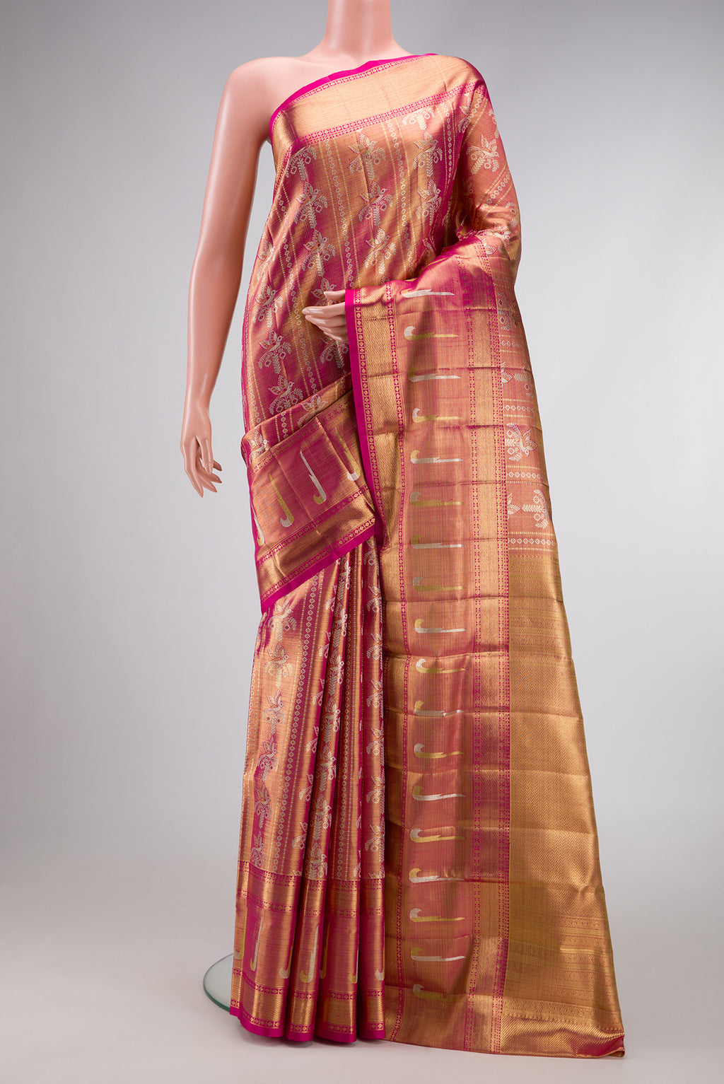 Magenta Dual Tone Kanjivaram Tissue Silk Saree with Zari Brocade on the body and Paithani Border.  displayed on a mannequin
