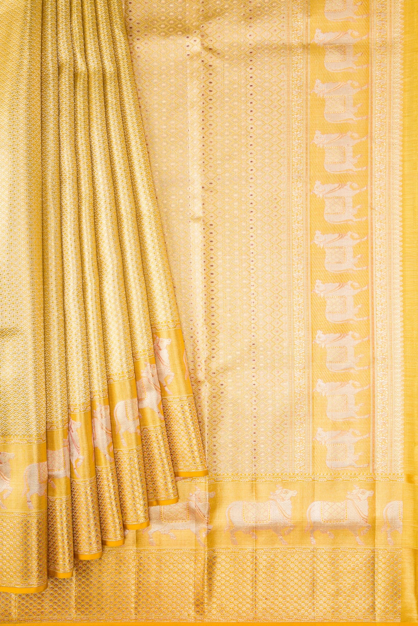Pleats and pallu of Pure Silk Pure Zari Yellow Dual Tone Kanjivaram Tissue Saree with Zari Brocade on the body and Fancy Border. 