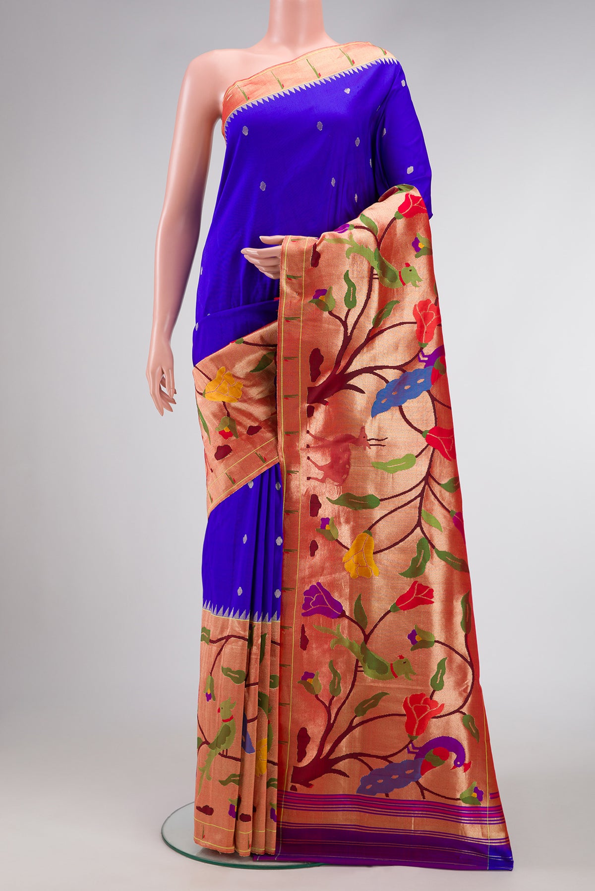 Pure Silk Pure Zari Royal Blue Dual Tone Paithani Saree with Zari Butta on the body and Paithani Border.  displayed on a mannequin
