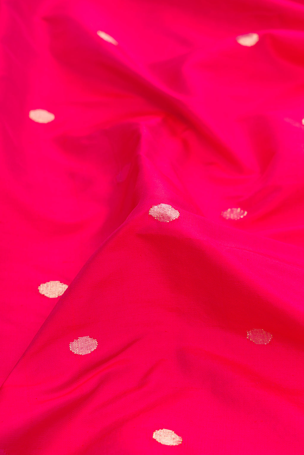 Close up of Pure Silk Pure Zari Pink Dual Tone Paithani Saree with Zari Butta on the body and Paithani Border.  displaying folds