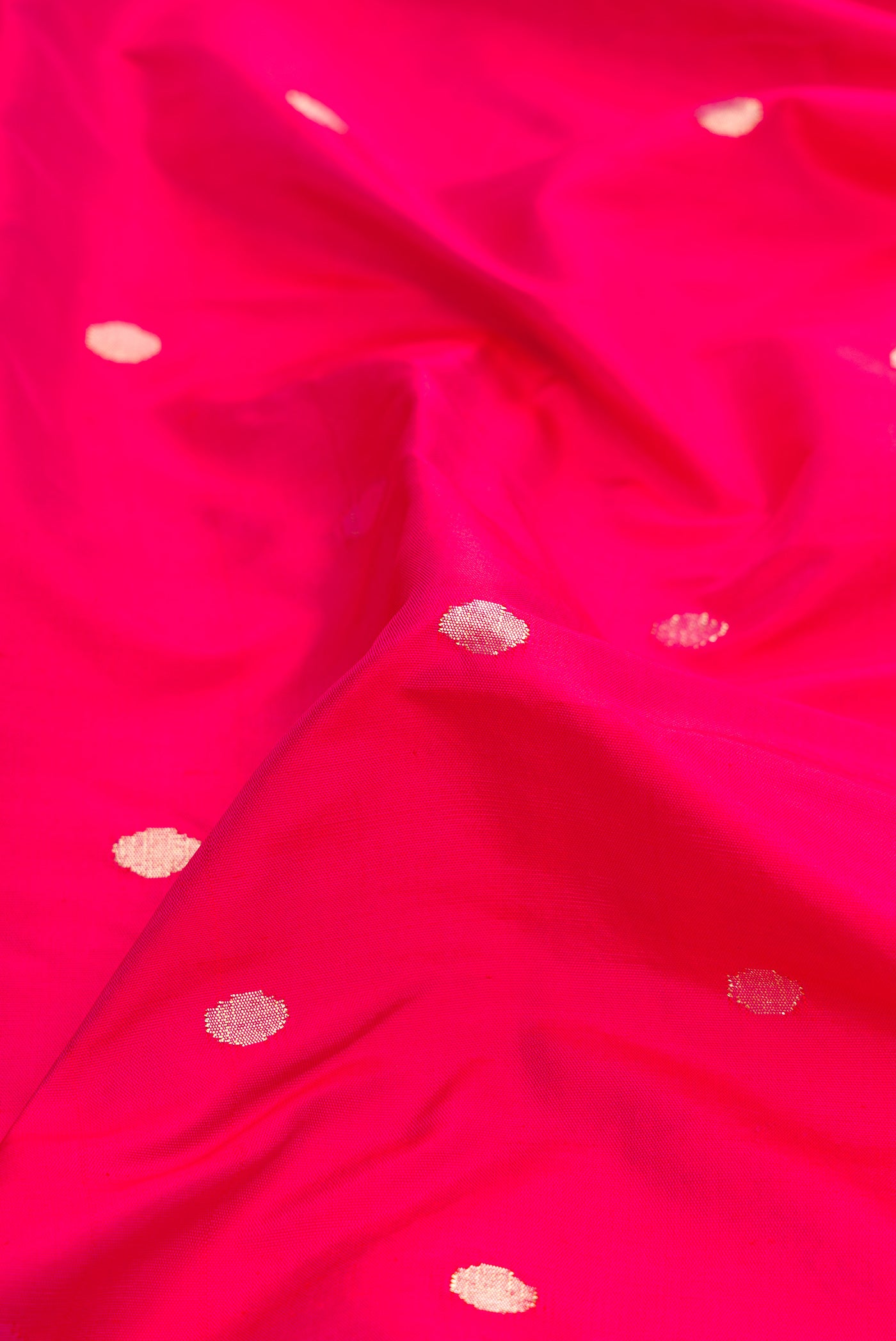 Close up of Pure Silk Pure Zari Pink Dual Tone Paithani Saree with Zari Butta on the body and Paithani Border.  displaying folds