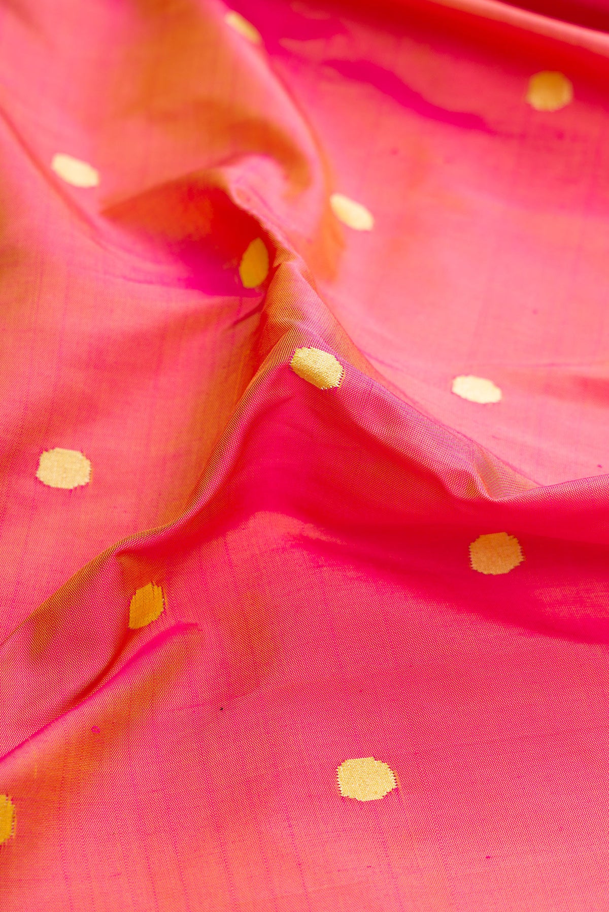 Close up of Pure Silk Pure Zari Pink Dual Tone Paithani Saree with Zari Butta on the body and Paithani Border.  displaying folds