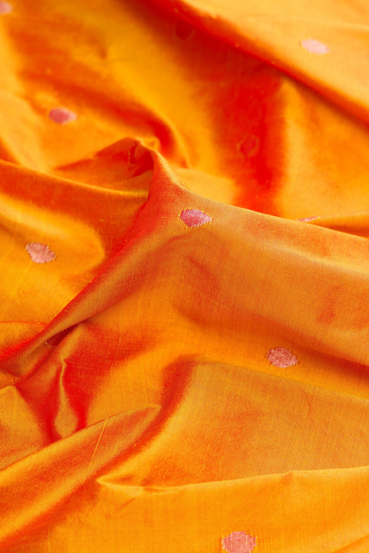 Close up of Pure Silk Pure Zari Mustard Dual Tone Paithani Saree with Zari Butta on the body and Paithani Border.  displaying folds