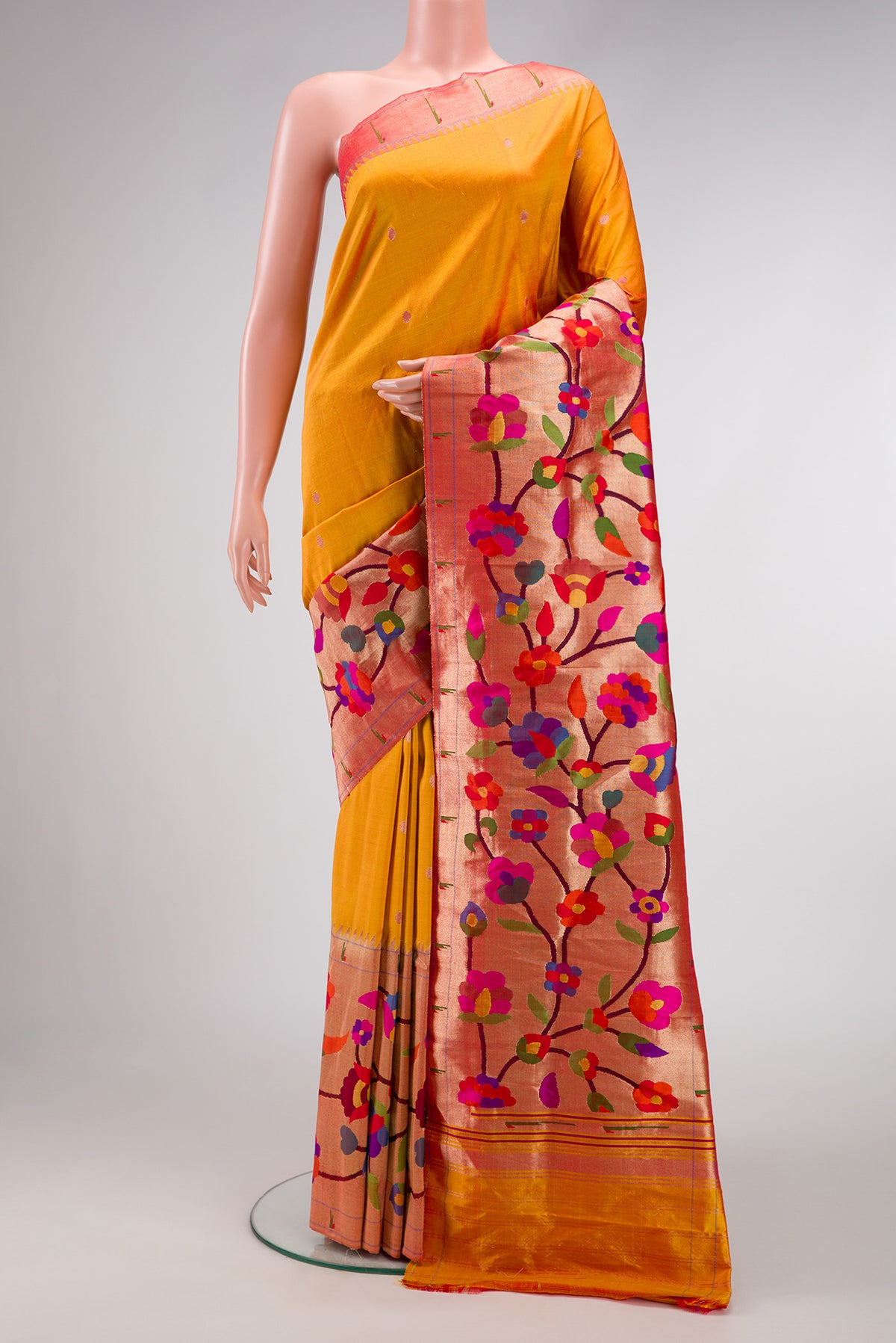 Pure Silk Pure Zari Mustard Dual Tone Paithani Saree with Zari Butta on the body and Paithani Border.  displayed on a mannequin