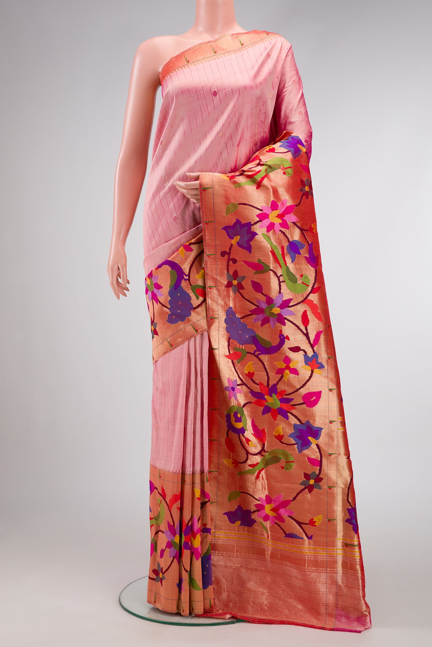 Pure Silk Pure Zari Rose Gold Dual Tone Paithani Saree with Stripes on the body and Paithani Border.  displayed on a mannequin