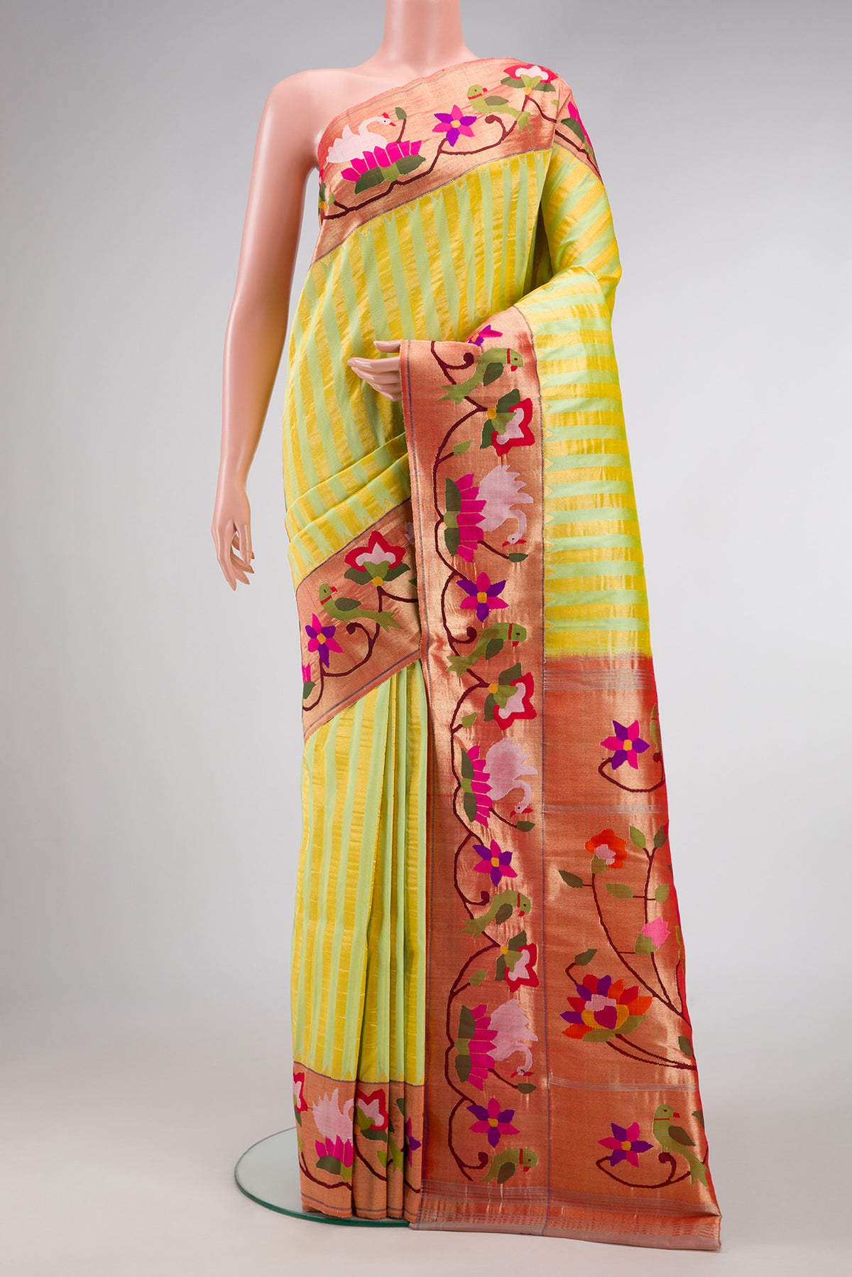 Pure Silk Pure Zari Pista Green Dual Tone Paithani Saree with Stripes on the body and Paithani Border.  displayed on a mannequin