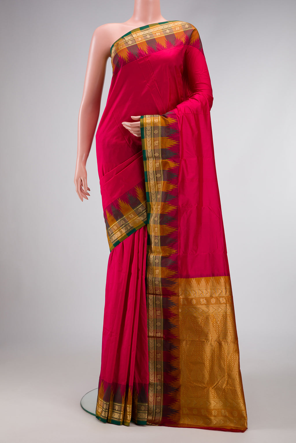 Dark Pink Dual Tone Kanjivaram Silk Saree with Plain Body and Temple Border.  displayed on a mannequin