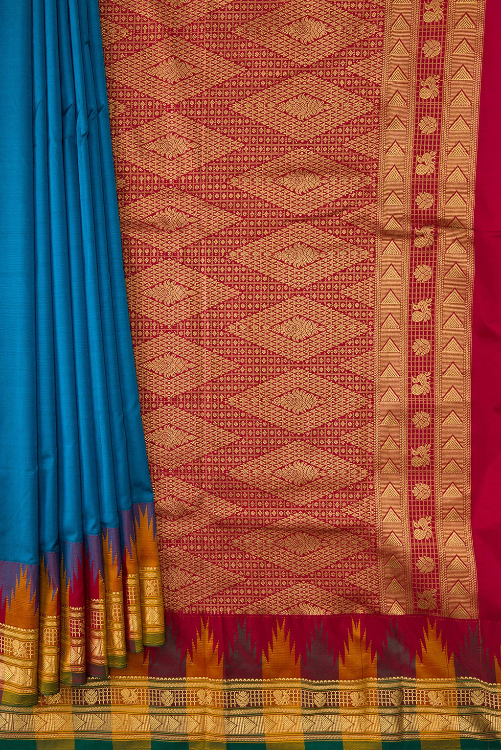 Pleats and pallu of Peacock Blue Dual Tone Kanjivaram Silk Saree with Zari Butta on the body and Temple Border. 