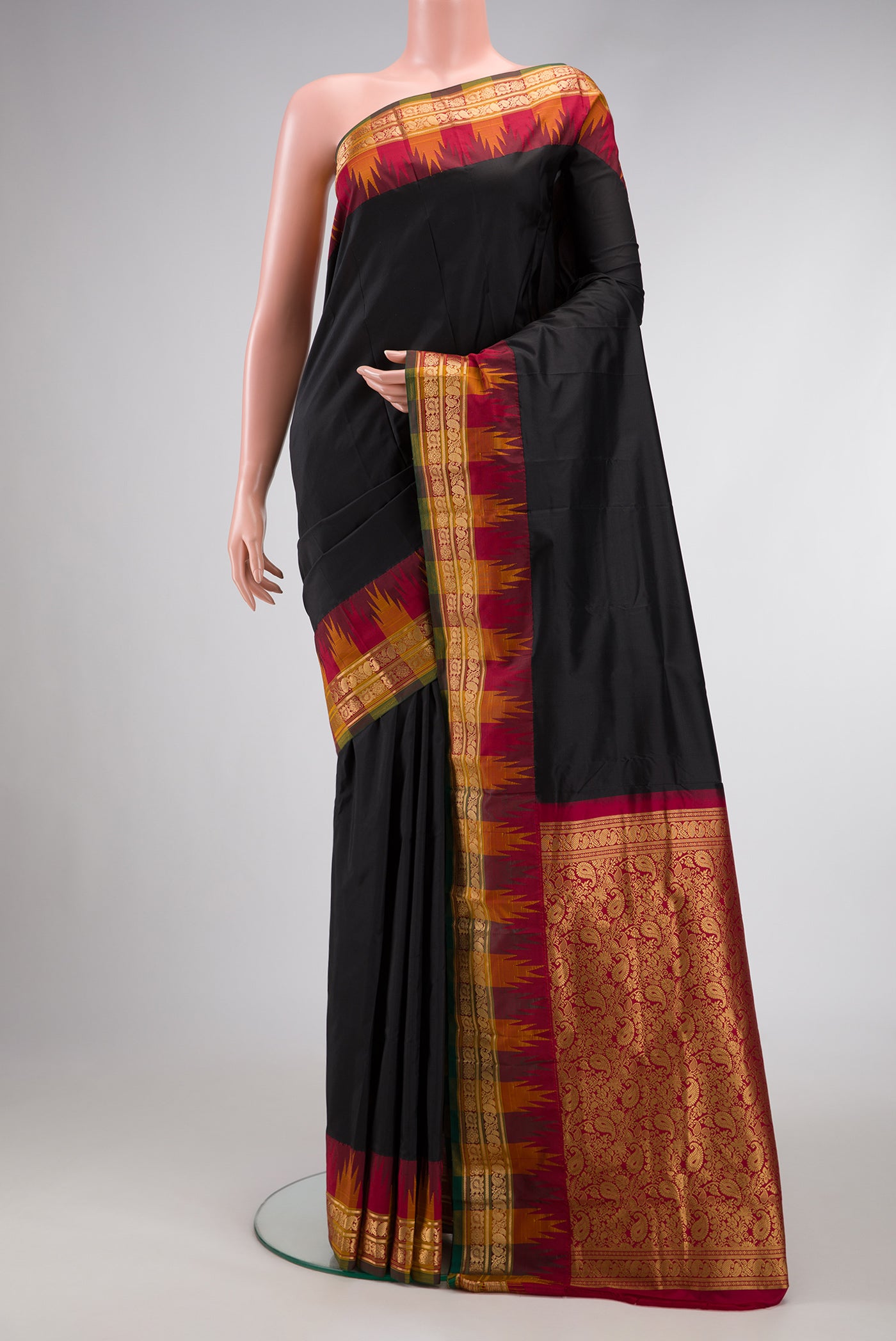 Black Dual Tone Kanjivaram Silk Saree with Plain Body and Zari Border.  displayed on a mannequin