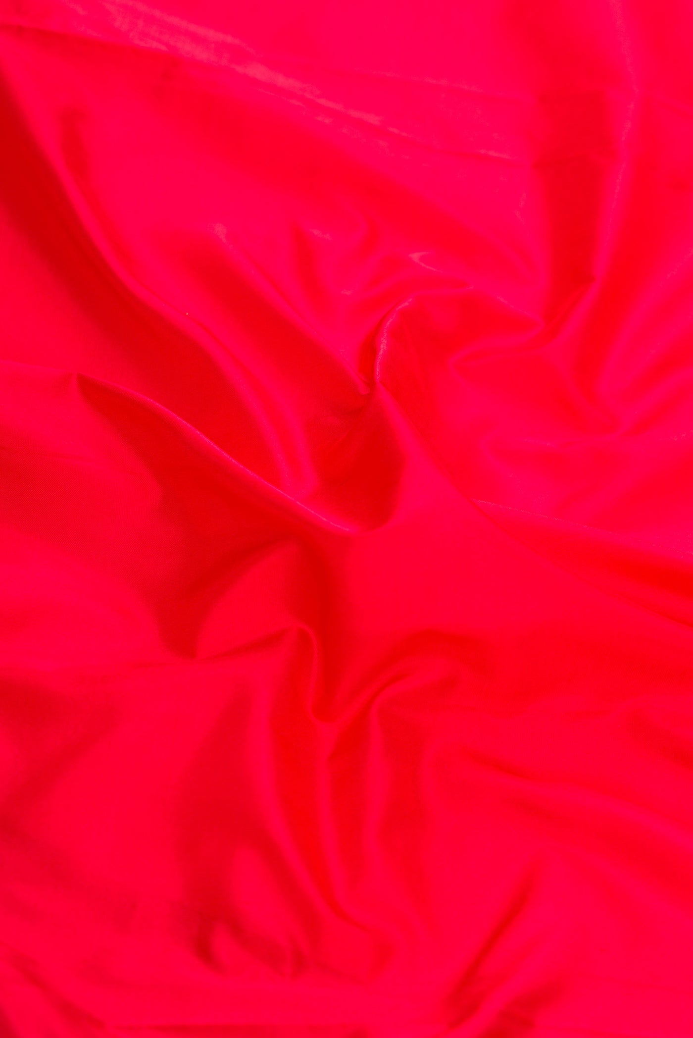 Close up of Red Dual Tone Kanjivaram Silk Saree with Plain Body and Temple Border.  displaying folds
