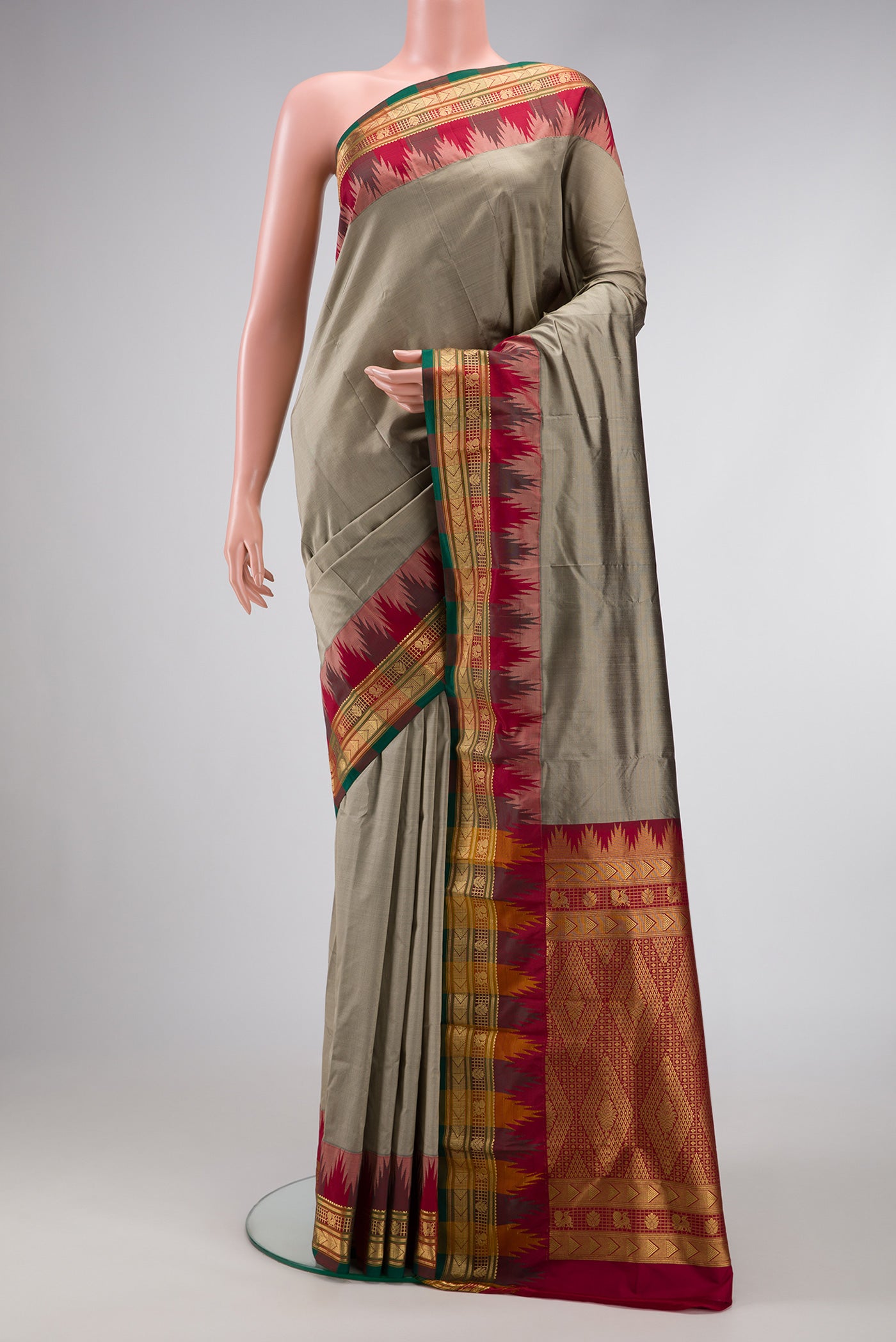 Grey Dual Tone Kanjivaram Silk Saree with Plain Body and Temple Border.  displayed on a mannequin