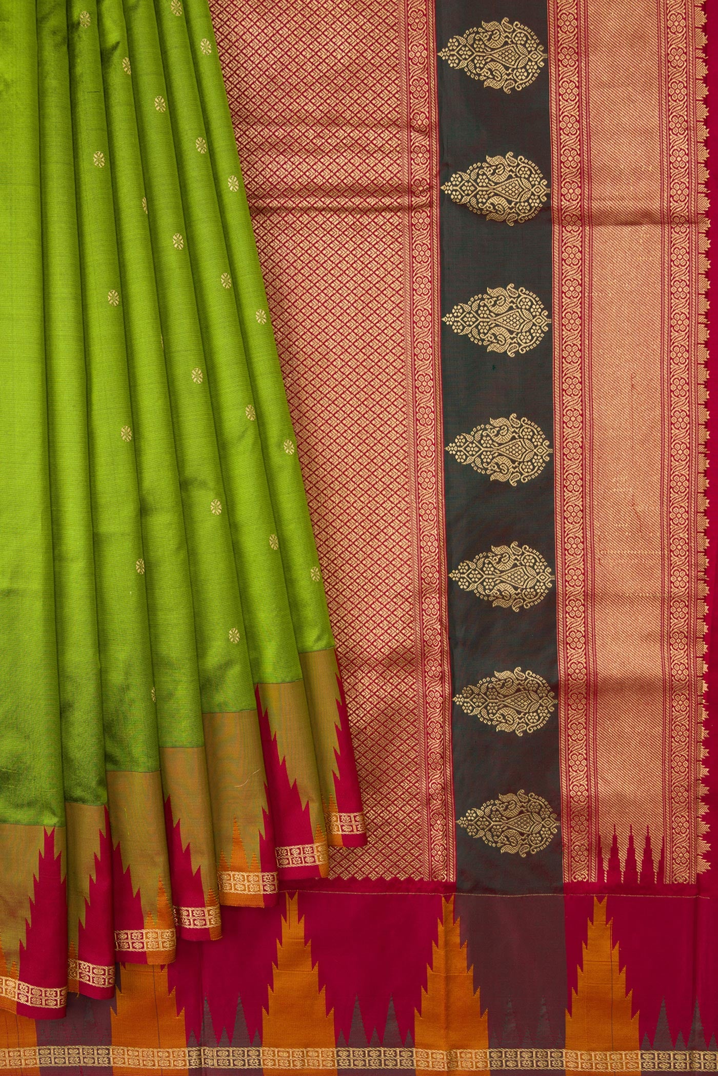 Pleats and pallu of Green Dual Tone Kanchipuram Silk Saree with Zari Butta on the body and Temple Border. 