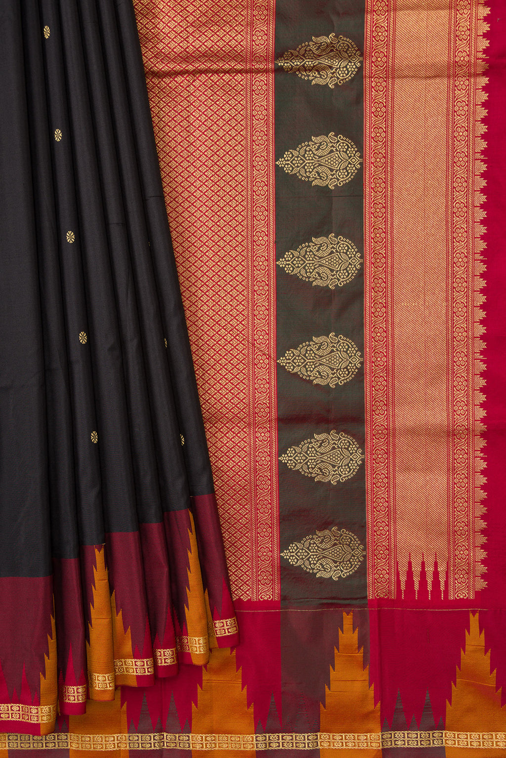 Pleats and pallu of Black Dual Tone Kanchipuram Silk Saree with Zari Butta on the body and Temple Border. 