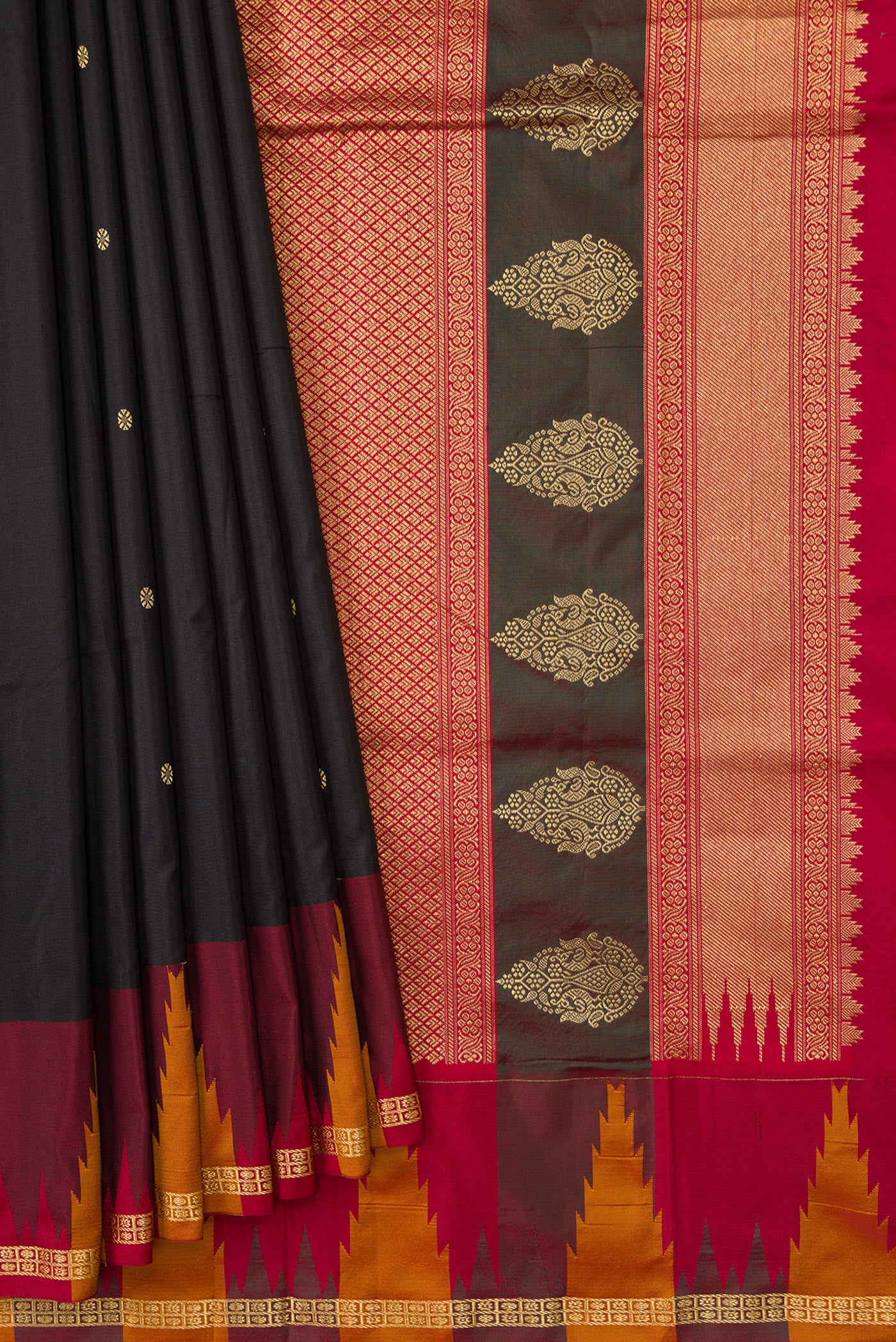 Pleats and pallu of Black Dual Tone Kanchipuram Silk Saree with Zari Butta on the body and Temple Border. 