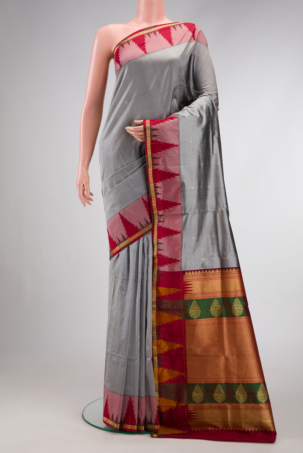 Grey Dual Tone Kanchipuram Silk Saree with Zari Butta on the body and Temple Border.  displayed on a mannequin