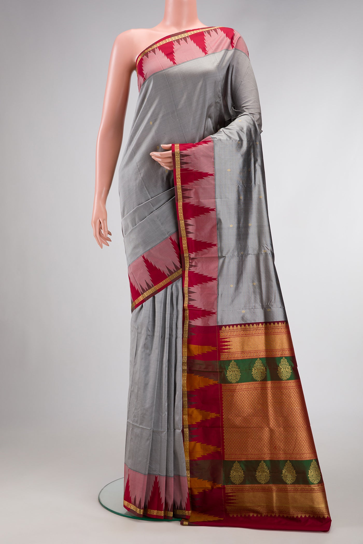 Grey Dual Tone Kanchipuram Silk Saree with Zari Butta on the body and Temple Border.  displayed on a mannequin