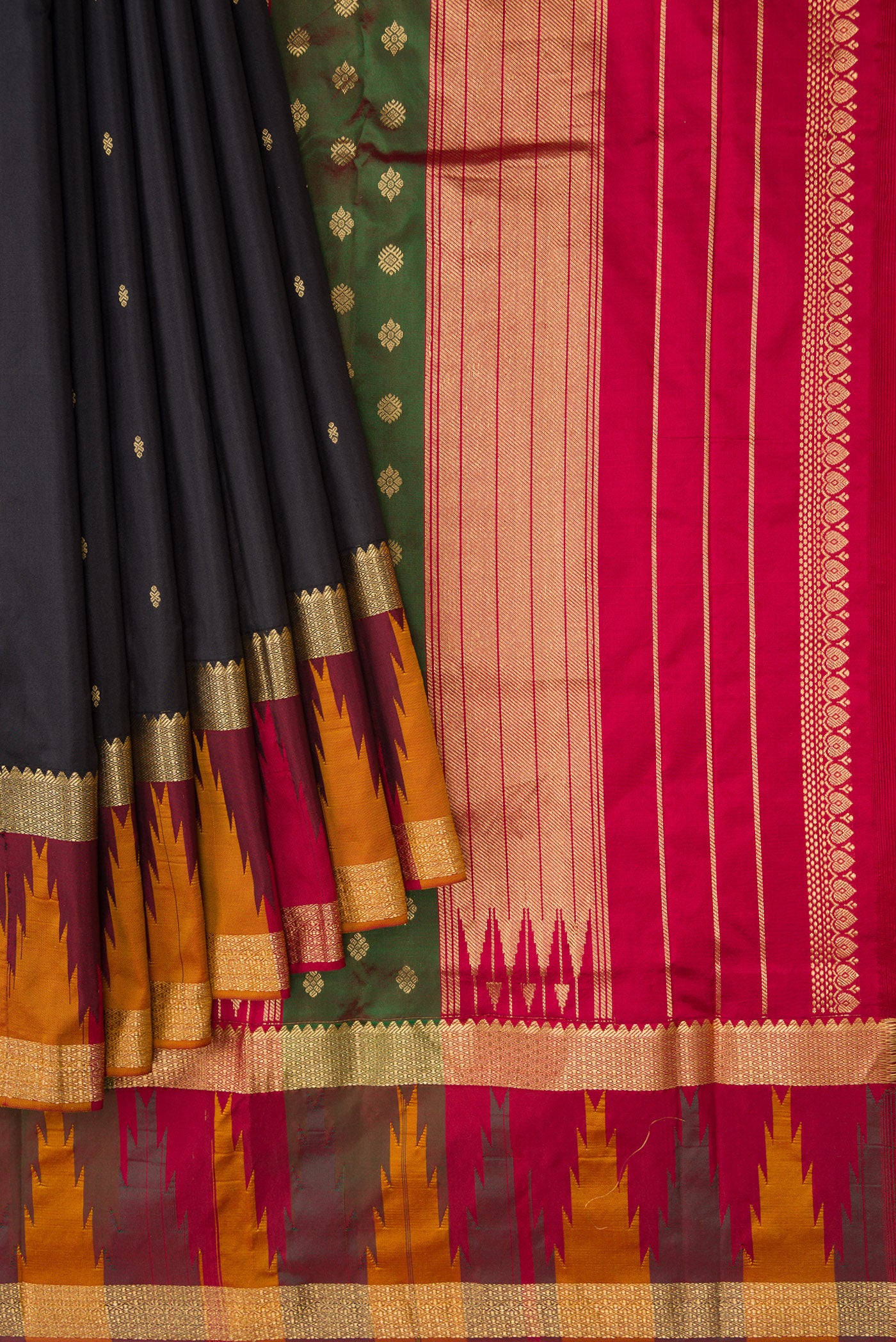 Pleats and pallu of Black Dual Tone Kanchipuram Silk Saree with Zari Butta on the body and Zari Border. 