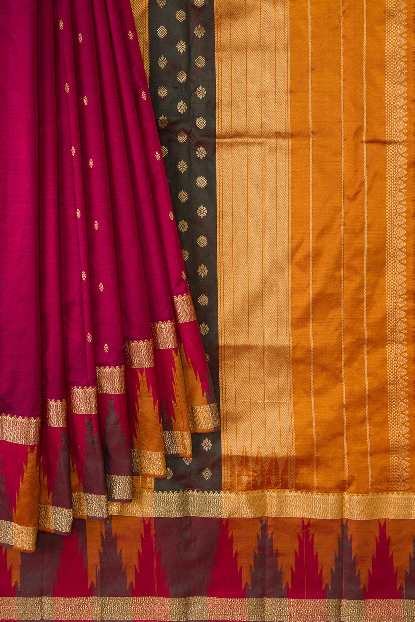 Pleats and pallu of Burgundy Dual Tone Kanchipuram Silk Saree with Zari Butta on the body and Temple Border. 