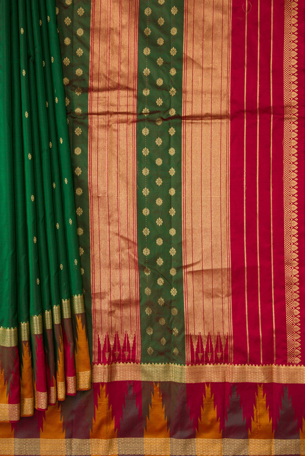 Pleats and pallu of Green Dual Tone Kanchipuram Silk Saree with Zari Butta on the body and Temple Border. 
