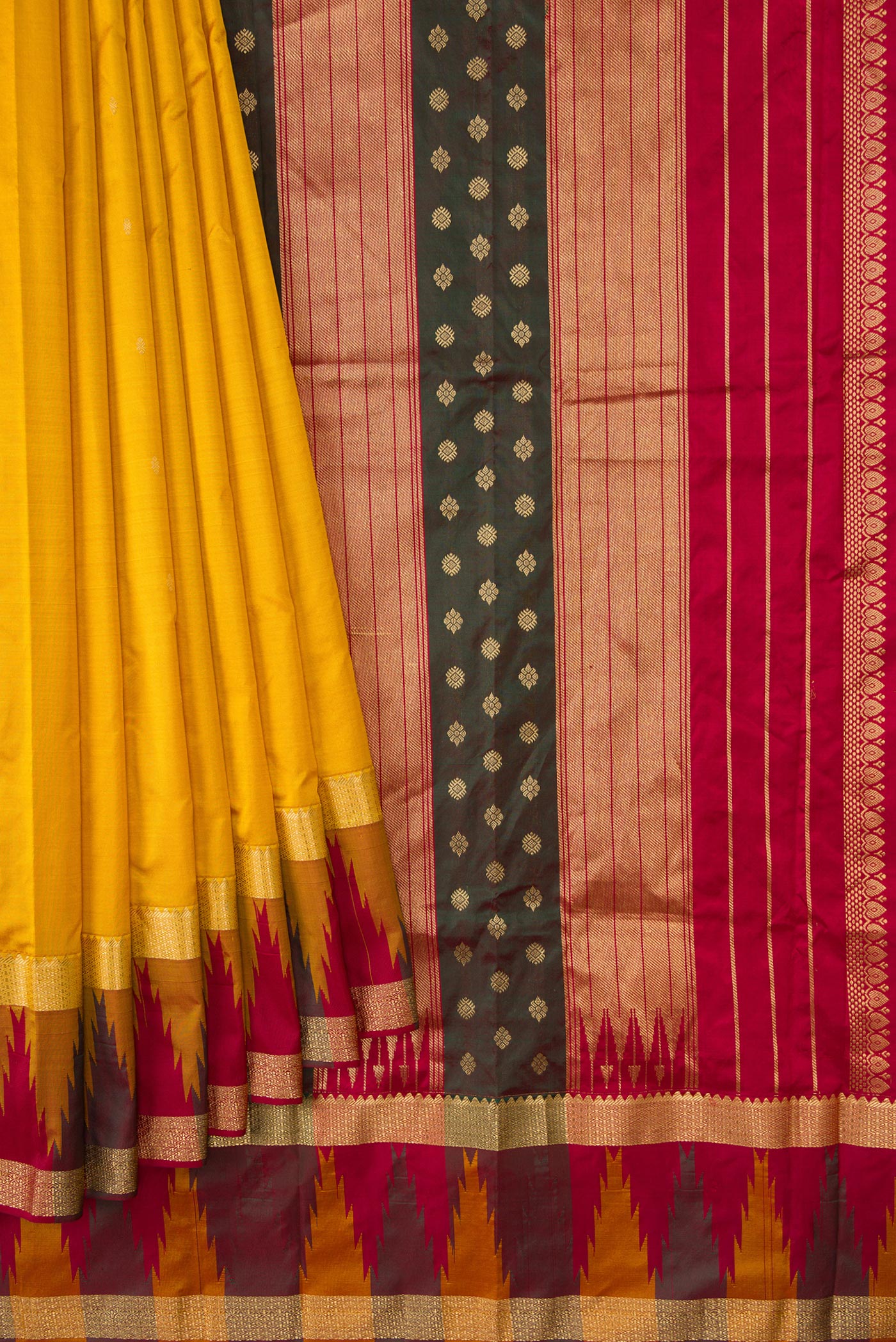 Pleats and pallu of Mustard Dual Tone Kanchipuram Silk Saree with Zari Butta on the body and Temple Border. 