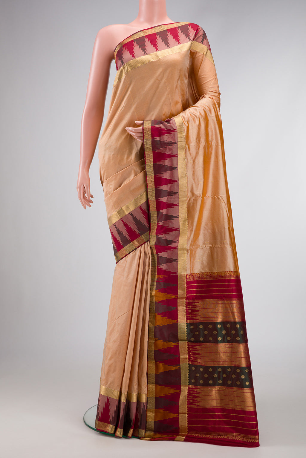 Sandal Dual Tone Kanchipuram Silk Saree with Zari Butta on the body and Temple Border.  displayed on a mannequin