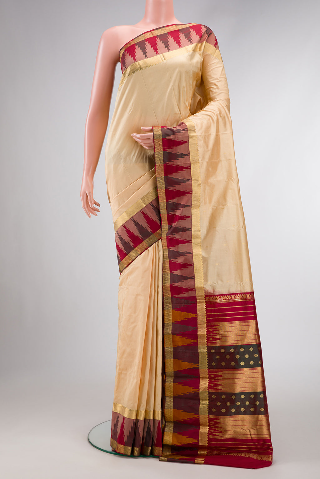 Sandal Dual Tone Kanchipuram Silk Saree with Zari Butta on the body and Temple Border.  displayed on a mannequin