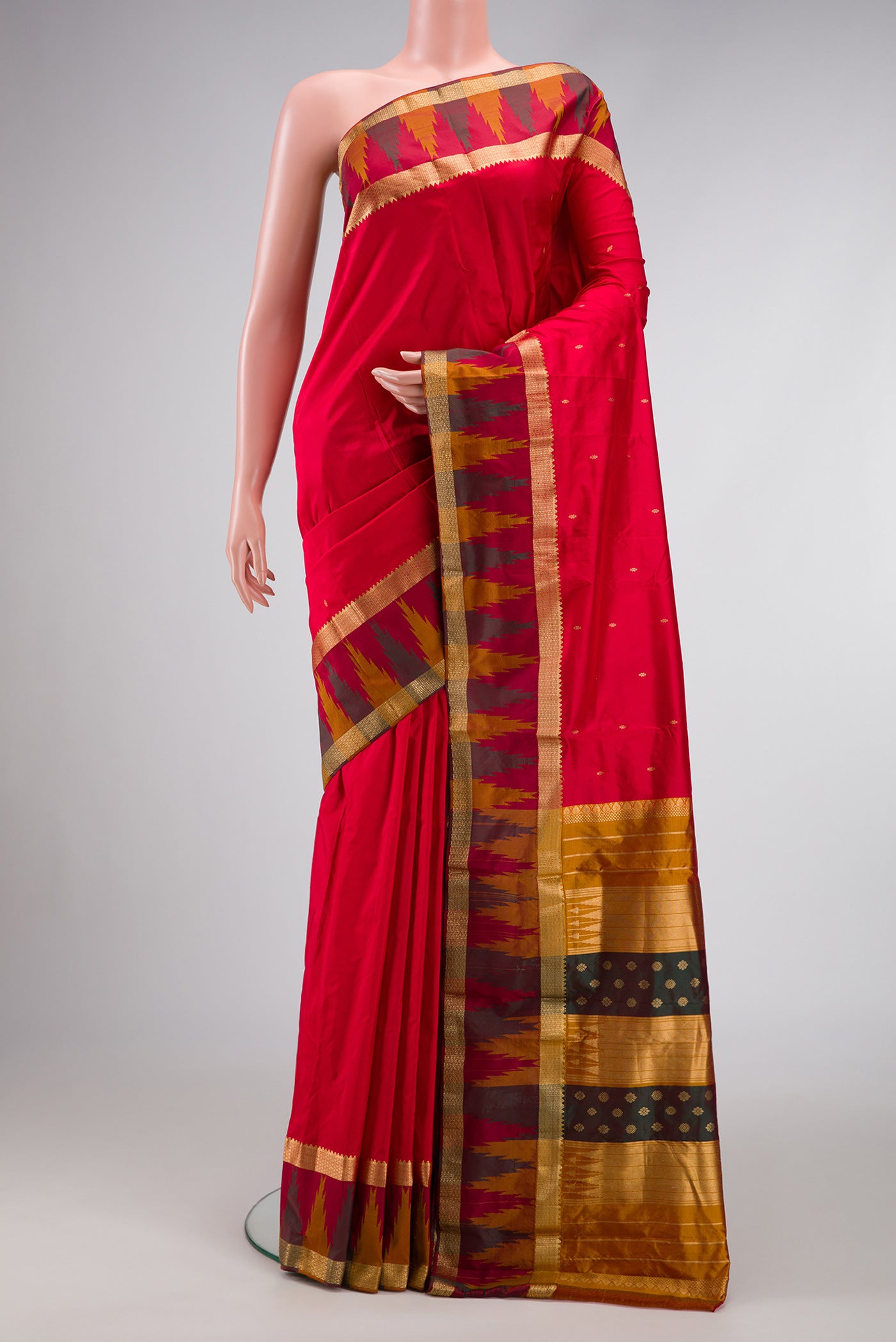 Red Dual Tone Kanchipuram Silk Saree with Zari Butta on the body and Temple Border.  displayed on a mannequin