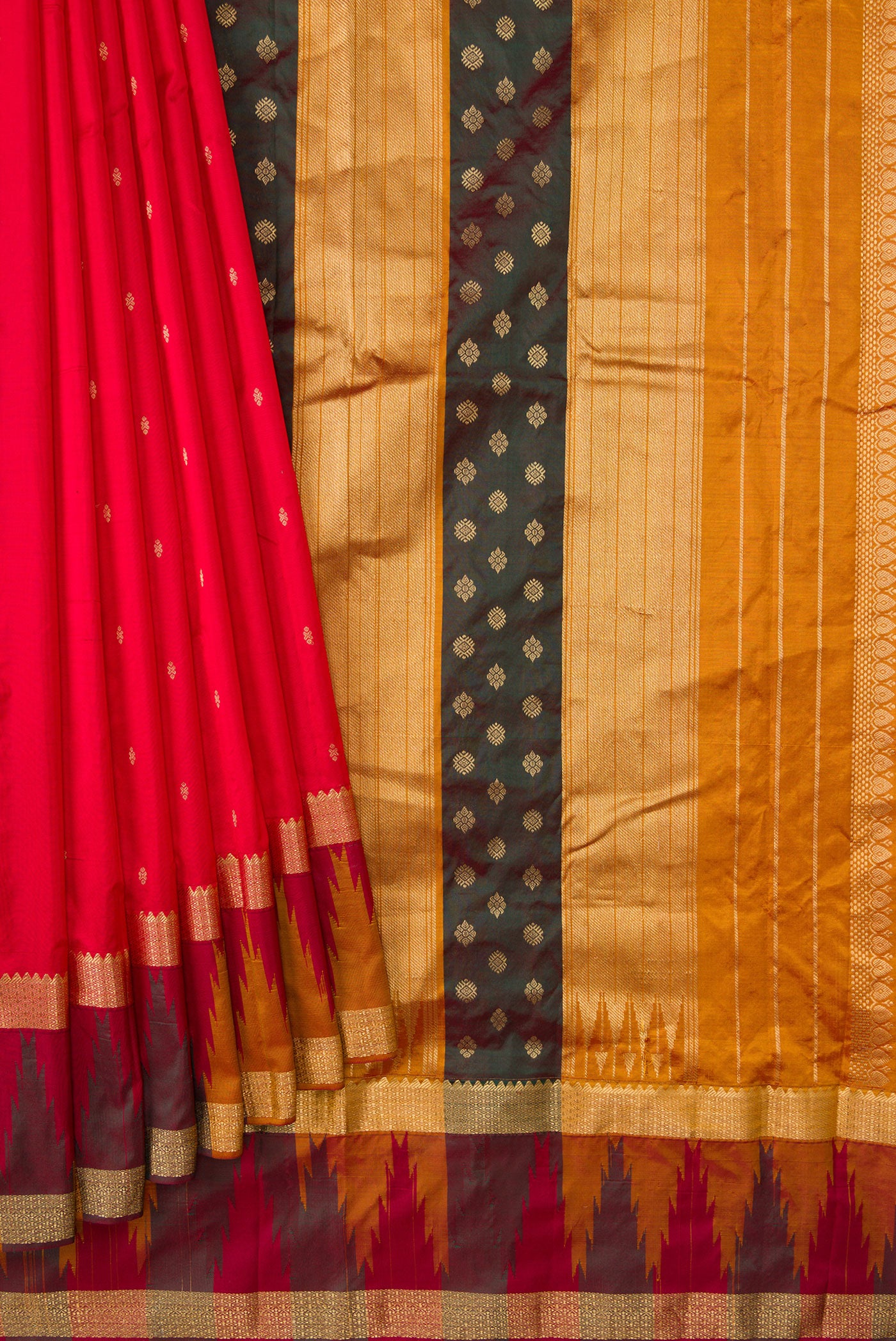 Pleats and pallu of Red Dual Tone Kanchipuram Silk Saree with Zari Butta on the body and Temple Border. 