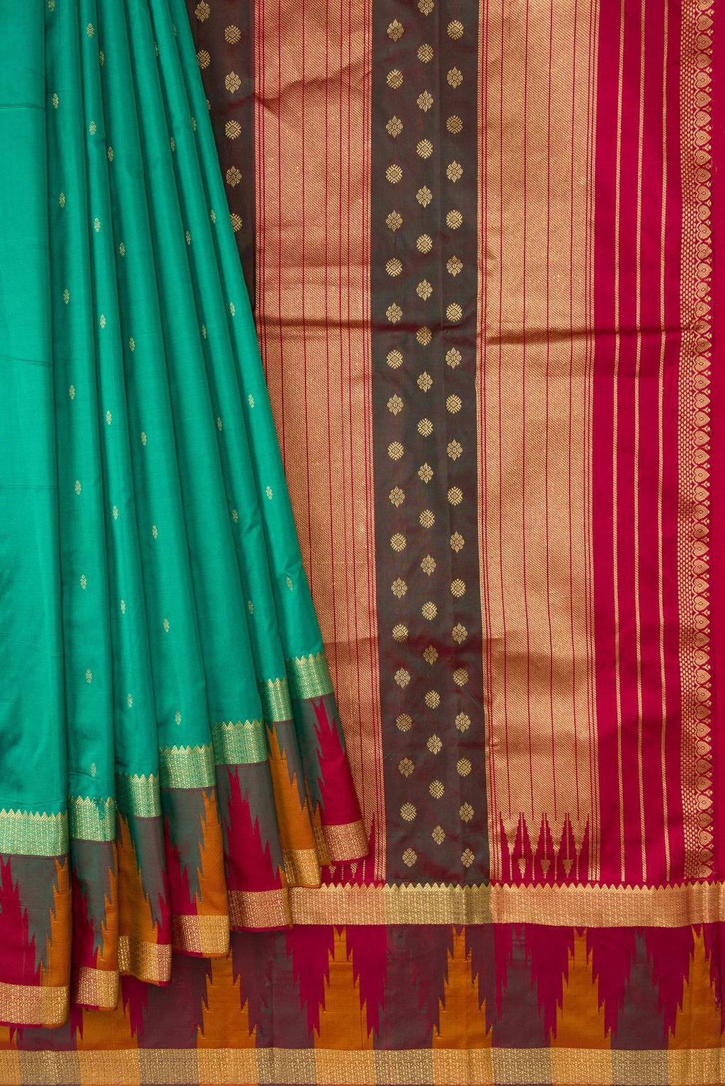 Pleats and pallu of Green Dual Tone Kanchipuram Silk Saree with Zari Butta on the body and Temple Border. 