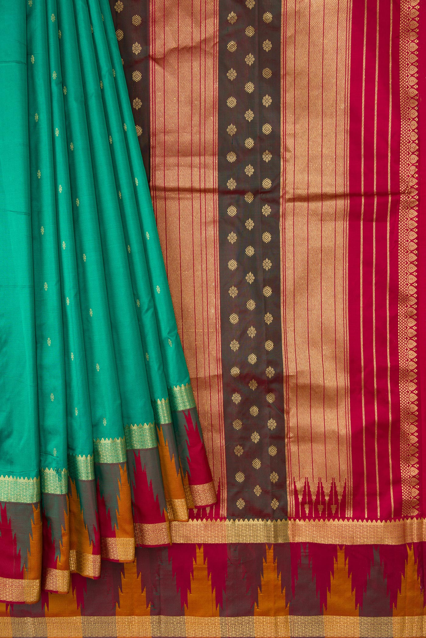 Pleats and pallu of Green Dual Tone Kanchipuram Silk Saree with Zari Butta on the body and Temple Border. 