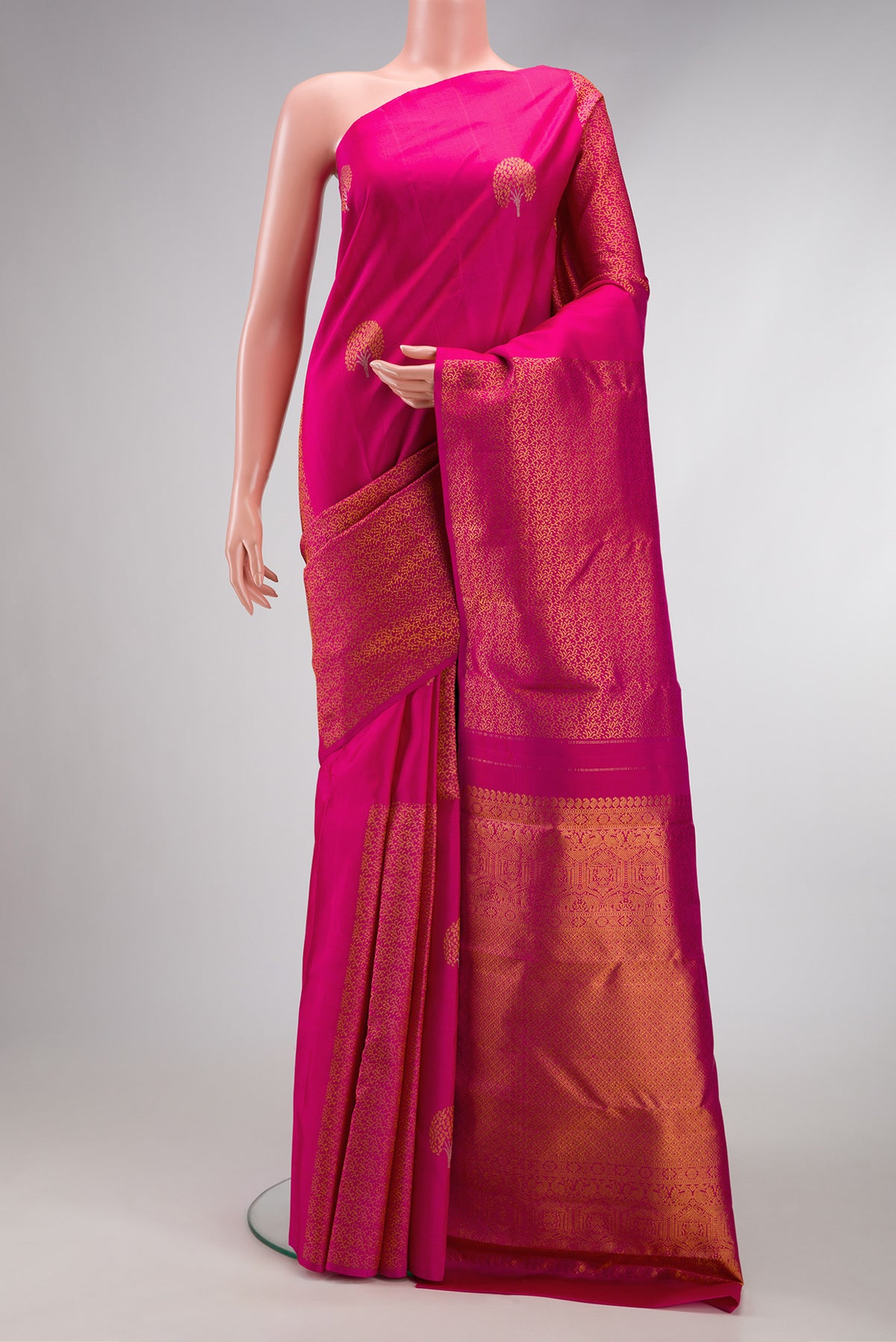 Dark Pink Dual Tone Kanjivaram Silk Saree with Zari Butta on the body and Without Border.  displayed on a mannequin
