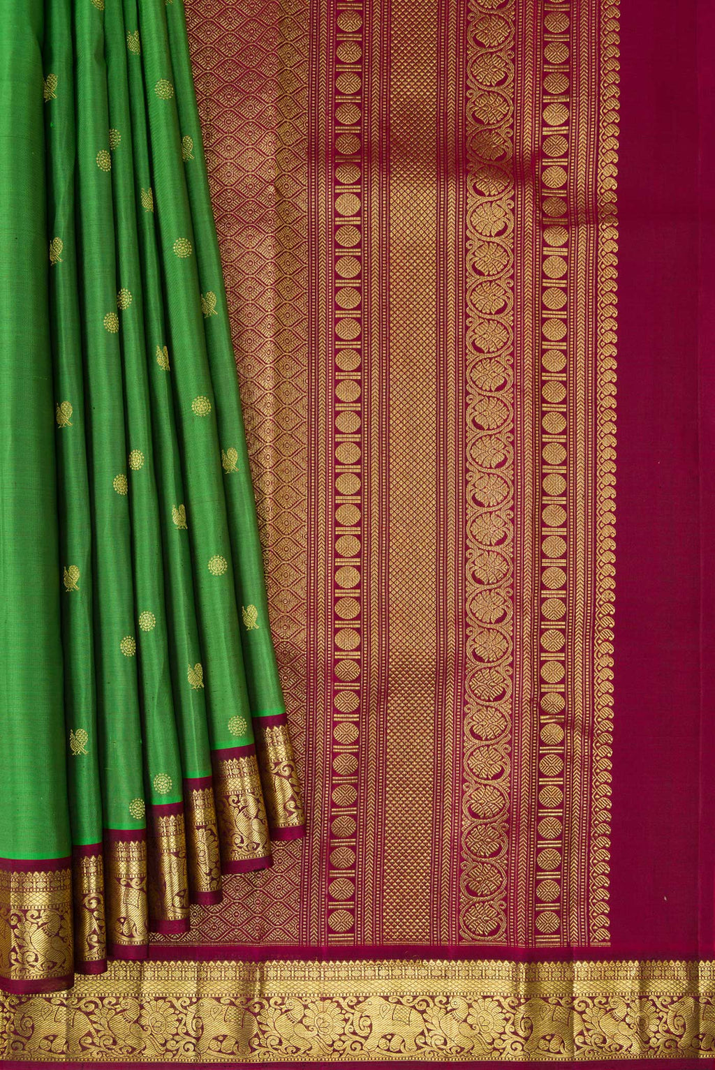 Pleats and pallu of Green Kanchipuram Silk Saree with Zari Butta on the body and Zari Border. 