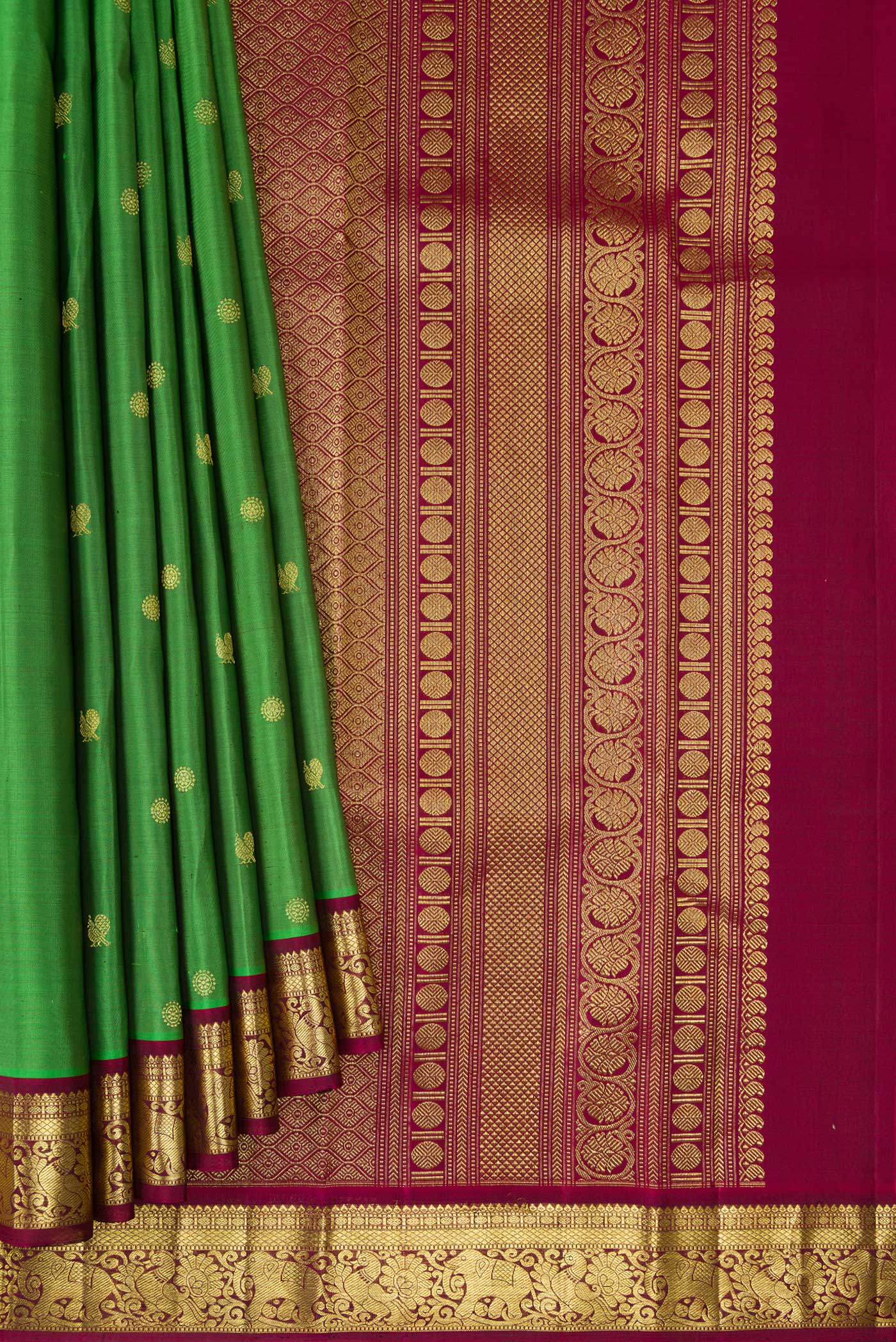 Pleats and pallu of Green Kanchipuram Silk Saree with Zari Butta on the body and Zari Border. 