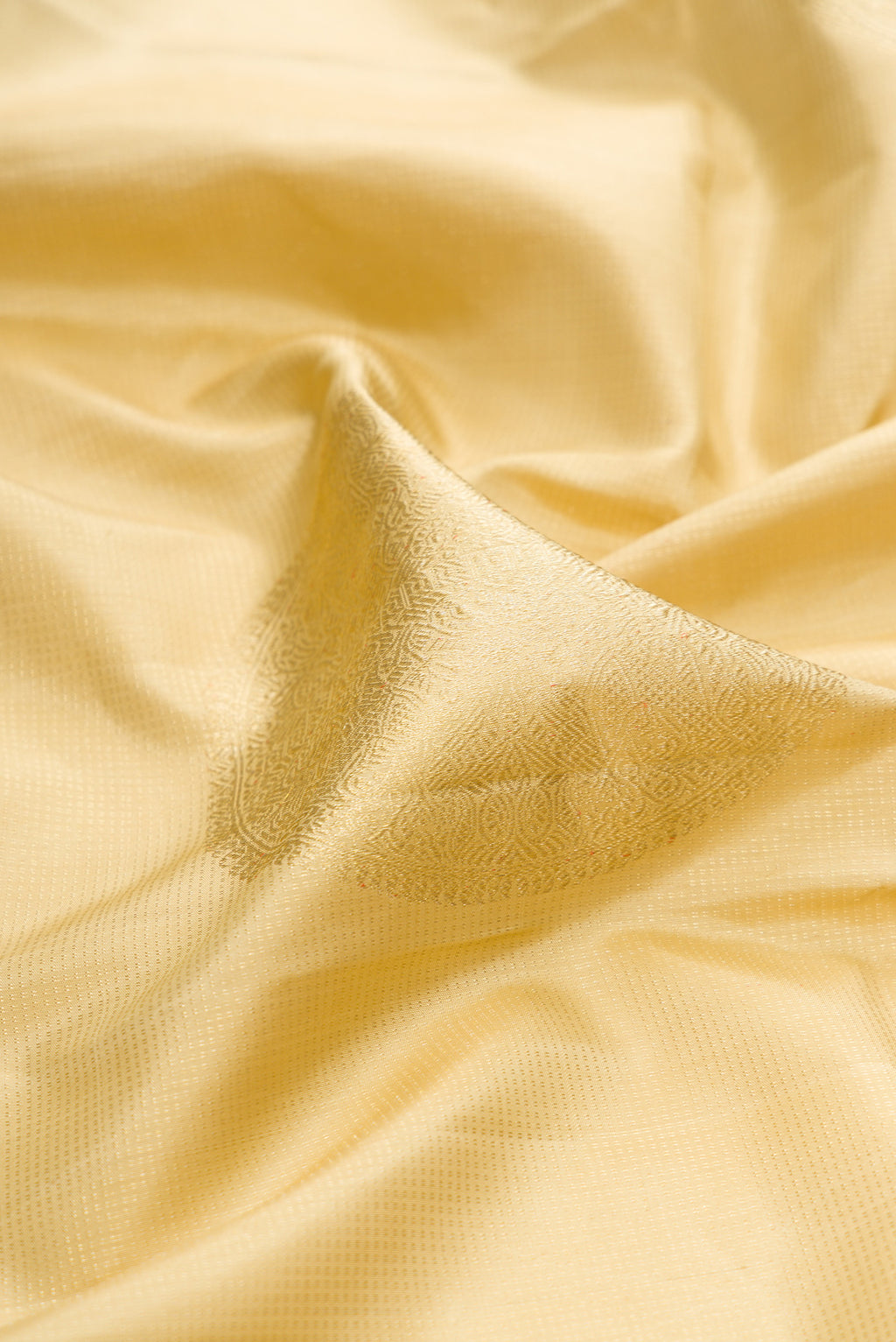 Close up of Sandal Kanjivaram Silk Saree with Stripes on the body and Without Border.  displaying folds