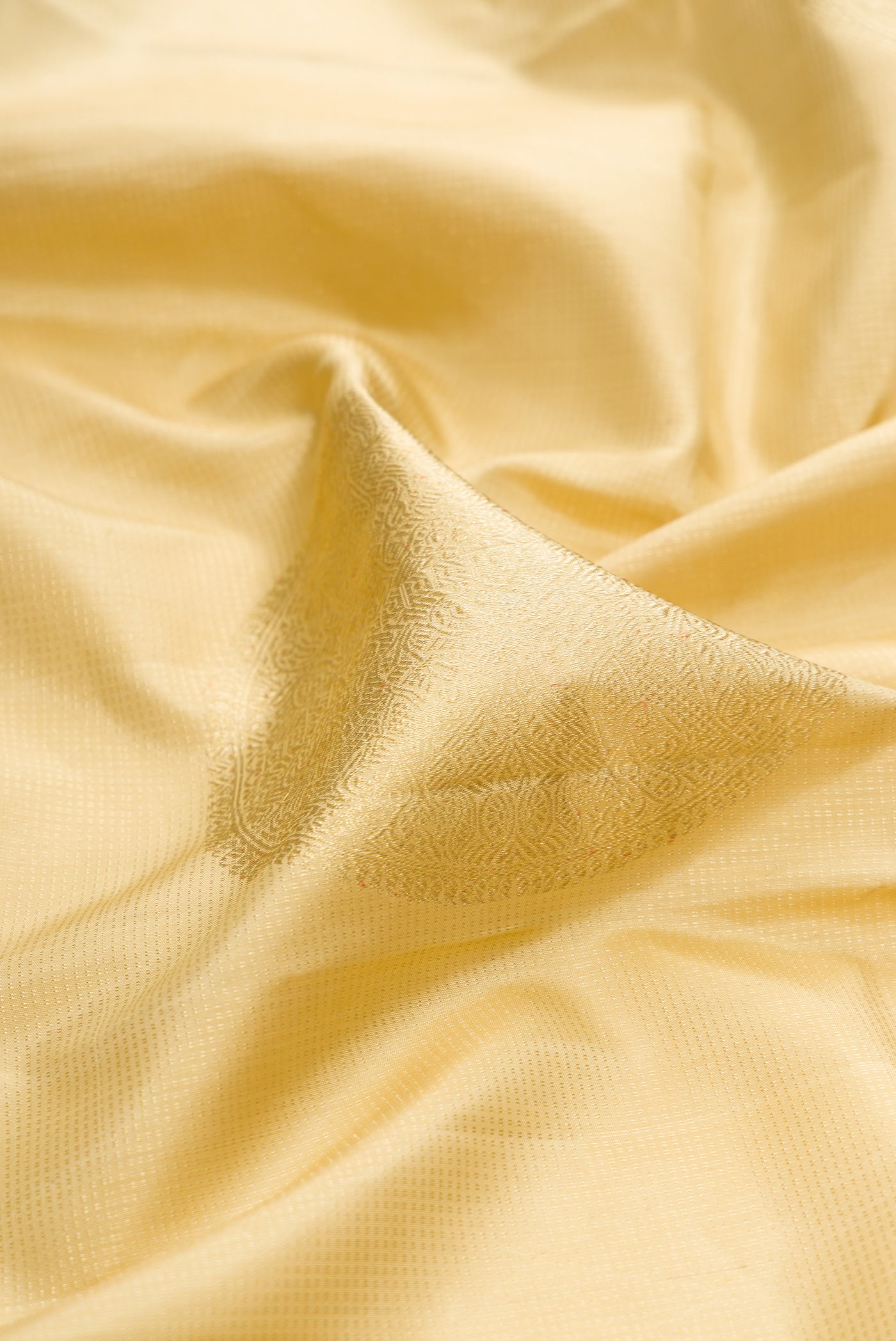 Close up of Sandal Kanjivaram Silk Saree with Stripes on the body and Without Border.  displaying folds