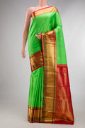 Pure Silk Parrot Green Kanjivaram Saree with Zari Butta on the body and Zari Border.  displayed on a mannequin